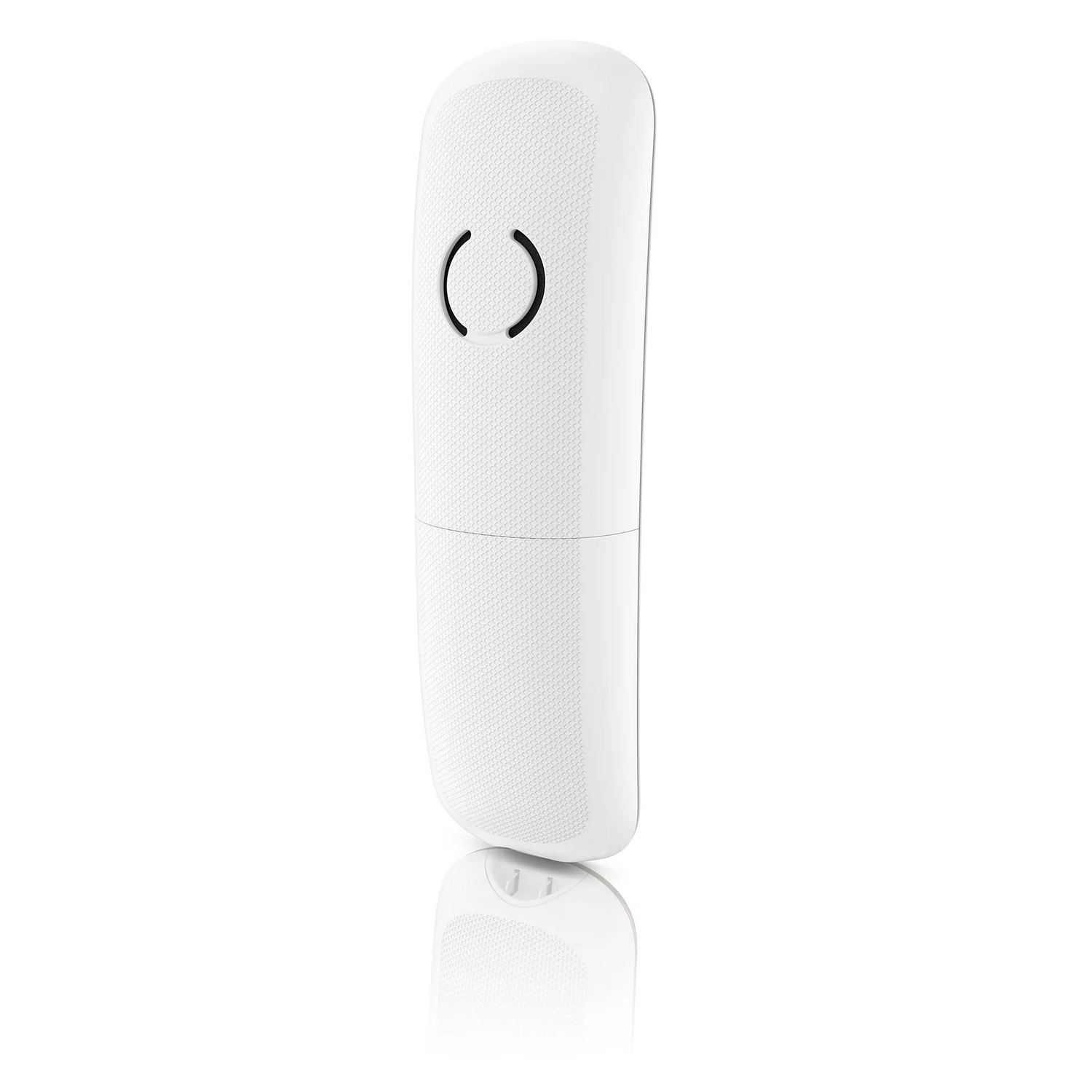 Téléphone sans fil blanc. Il y a deux cercles au milieu et il se reflète sur la surface blanche.
