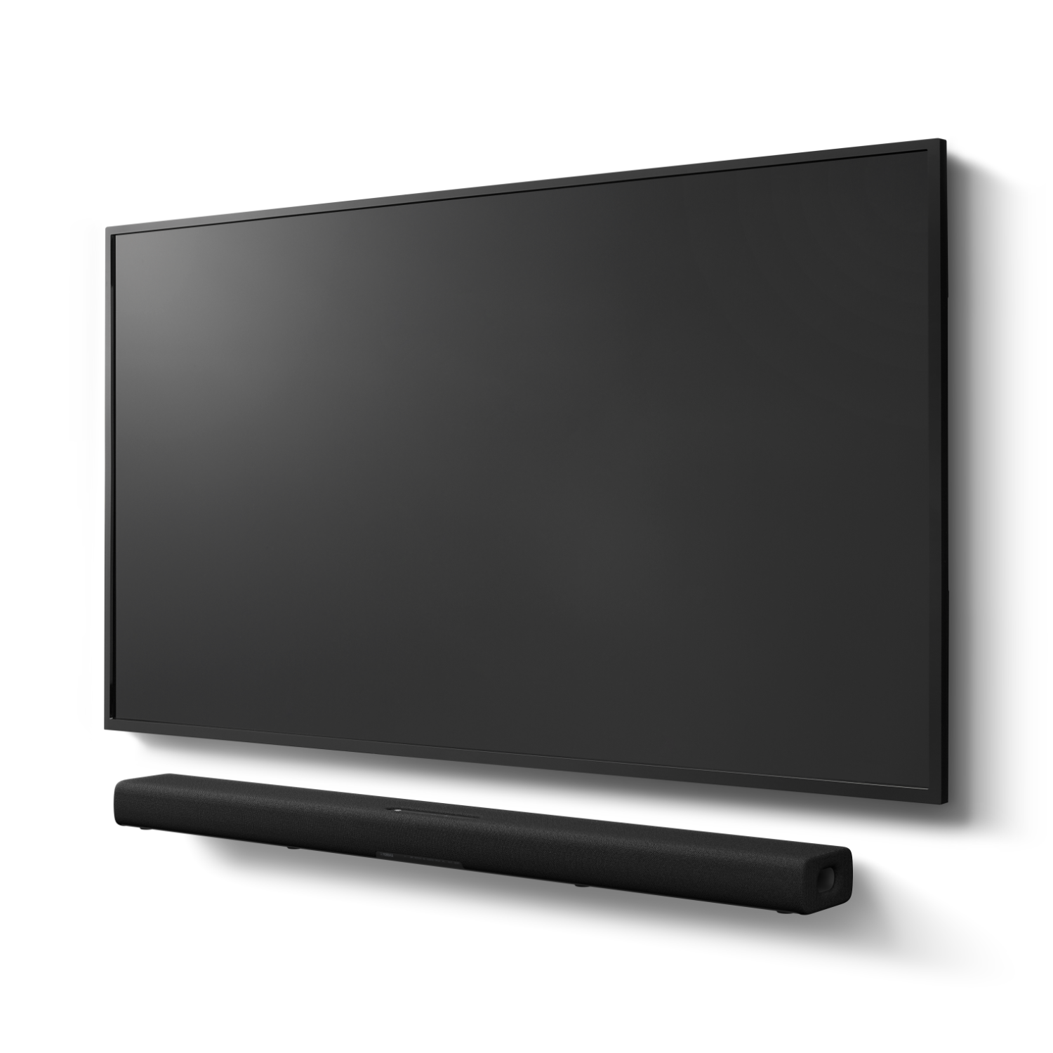 Una TV nera è montata su una parete bianca. Sotto la TV c'è una soundbar nera.