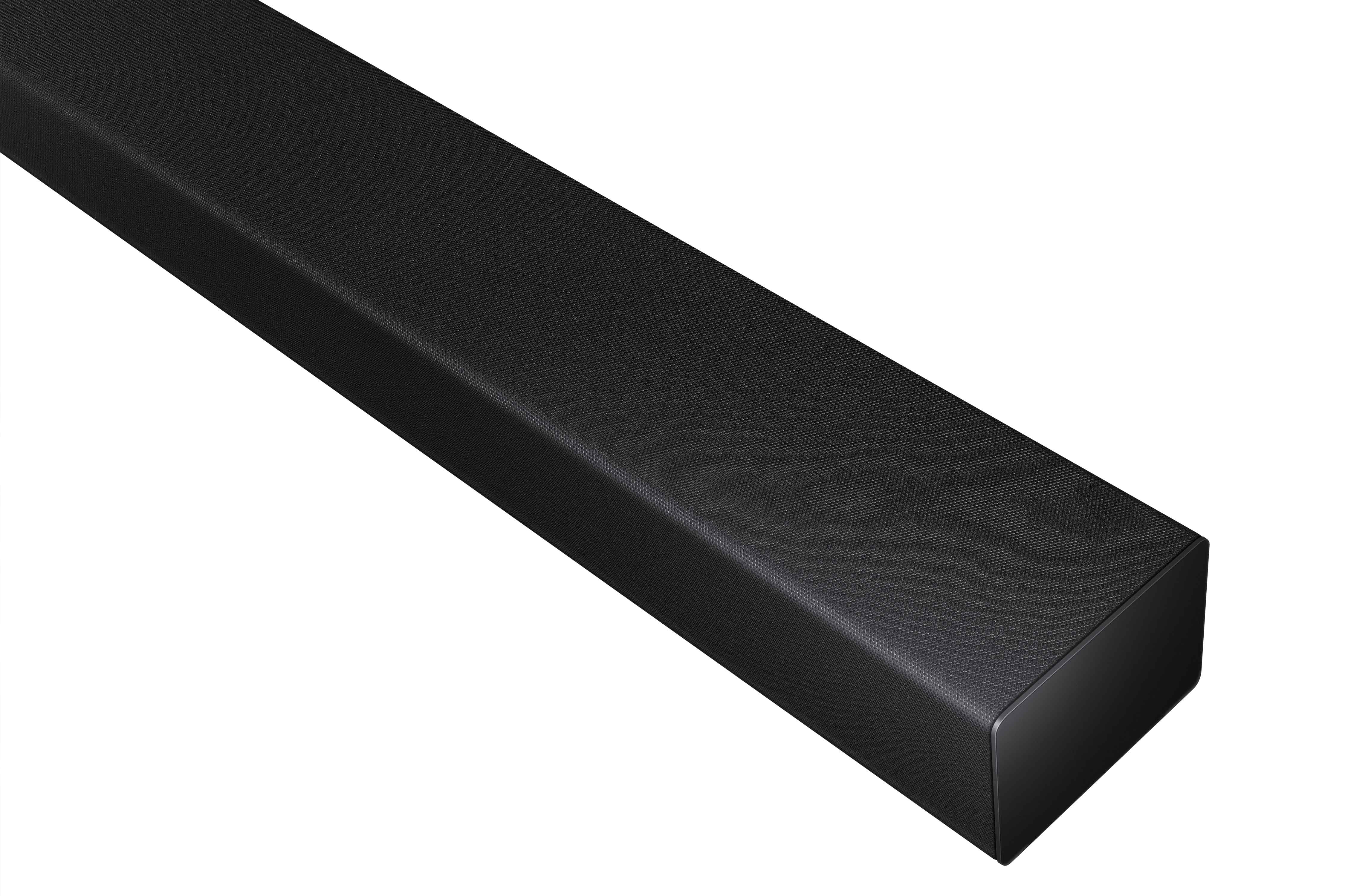 Une barre de son noire placée horizontalement. Elle a un design élégant avec une surface texturée.