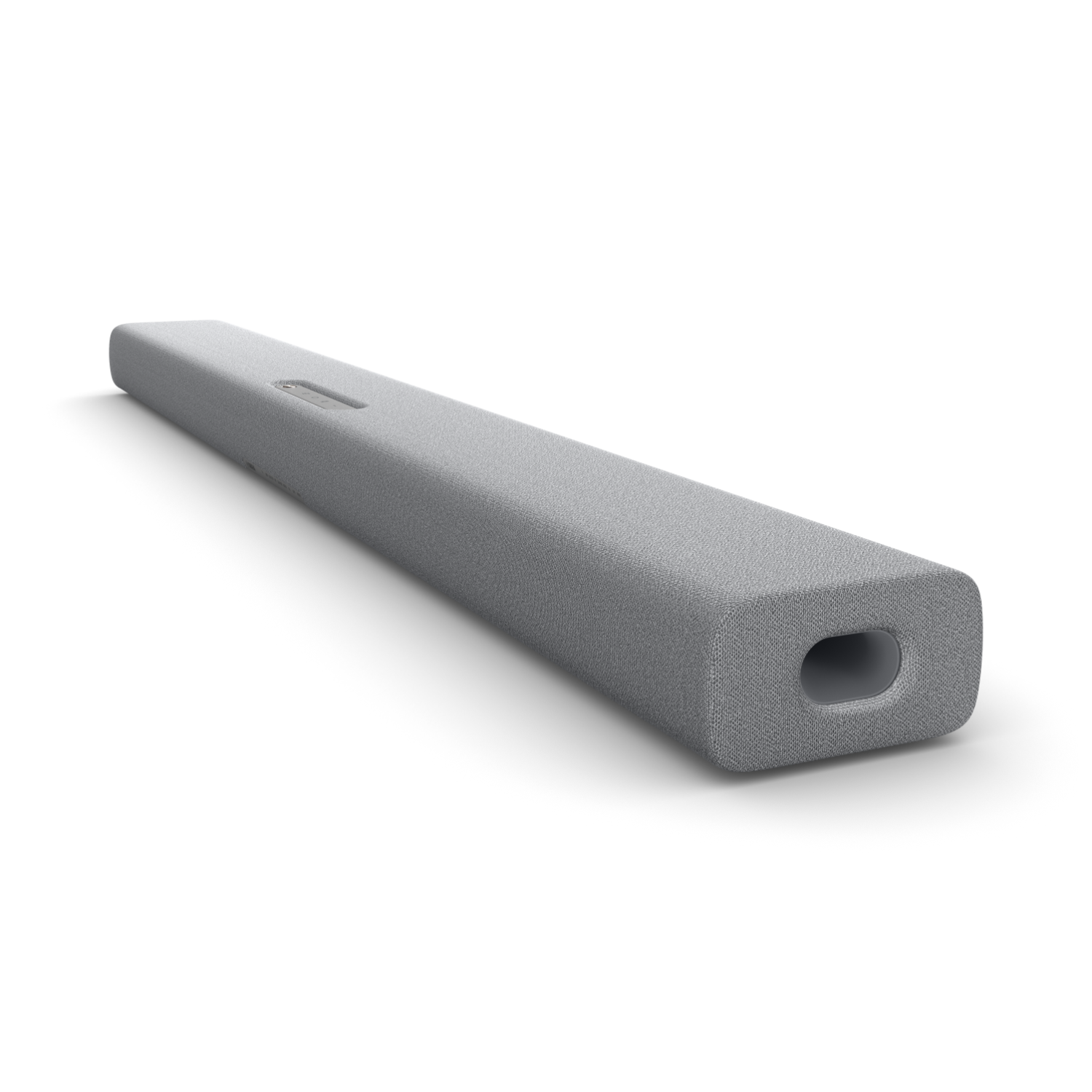 Szary soundbar o zaokrąglonym kształcie. Ma subtelny design i otwór na głośnik.