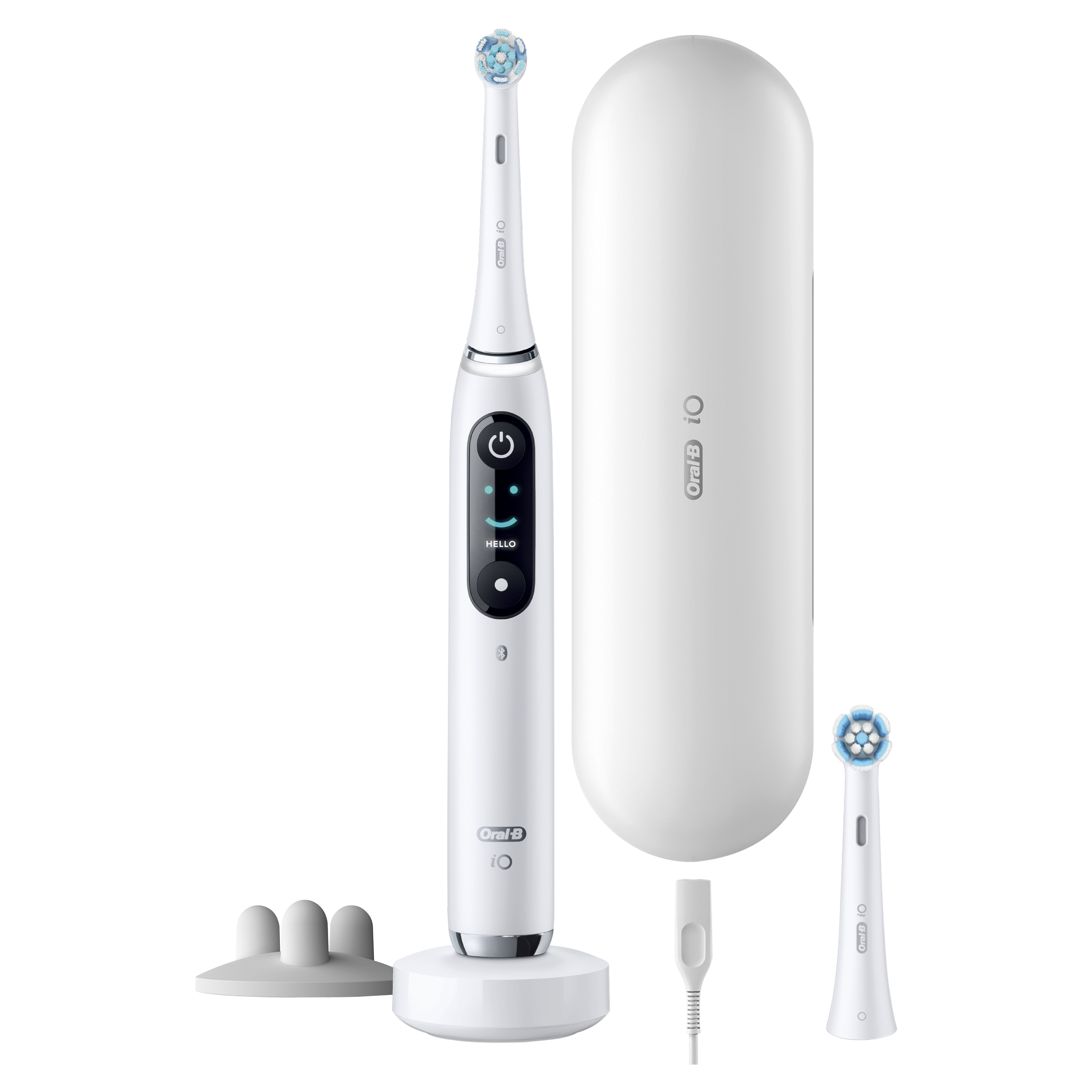 Juego de cepillo de dientes eléctrico blanco, incluyendo cargador y estuche de viaje.