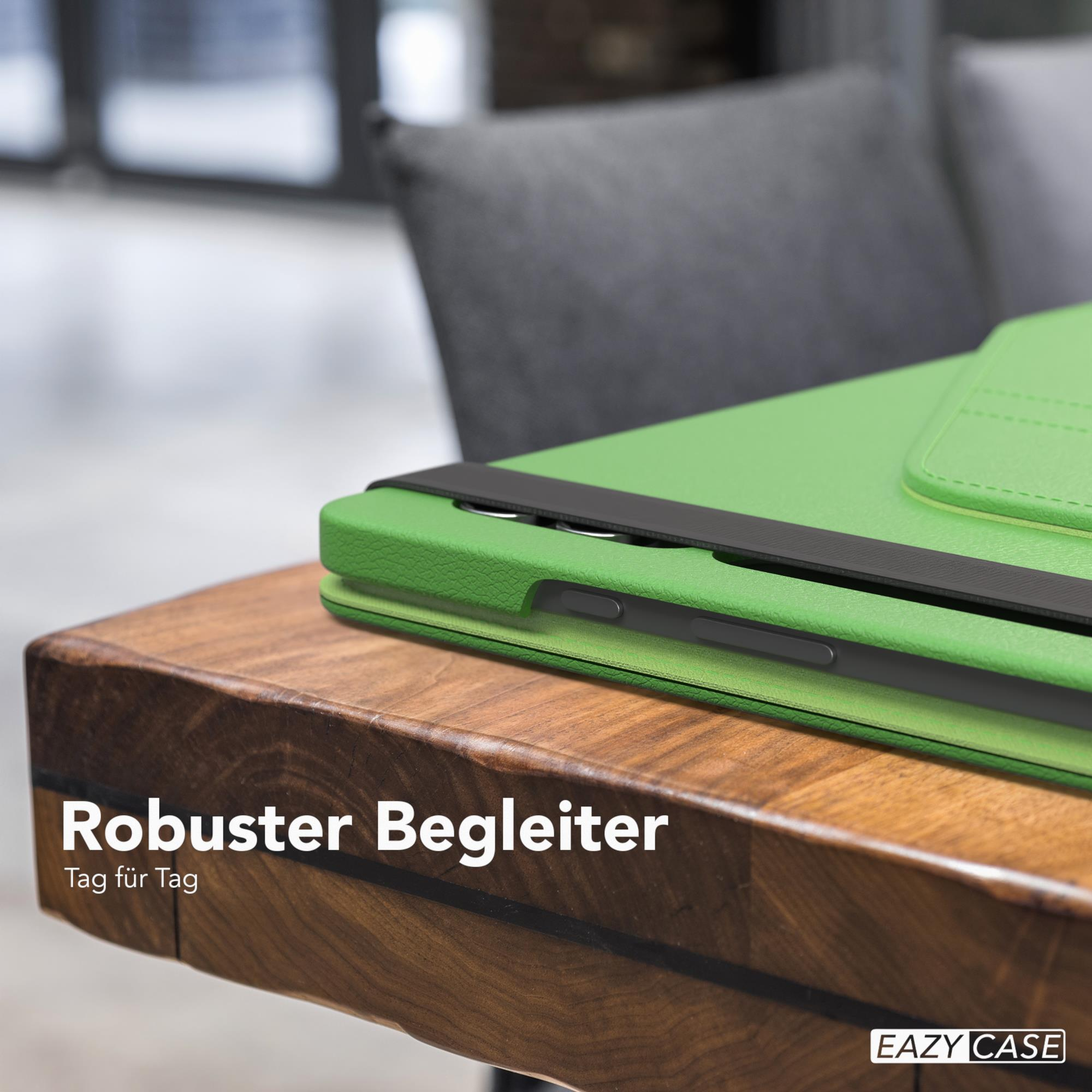 Grüne Tablethülle mit schwarzem Riemen auf einem Holztisch, mit Text.