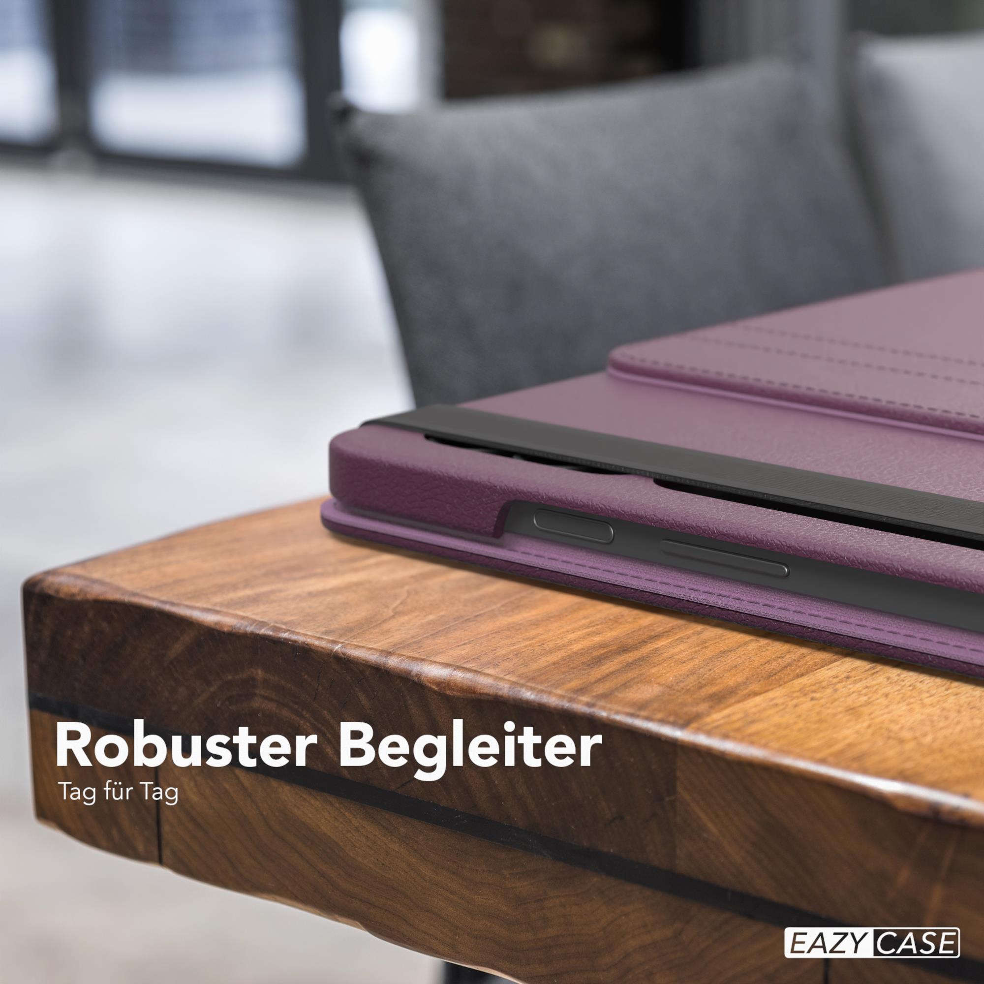 Eine lila Tablethülle auf einem Holztisch. Die Hülle hat einen schwarzen Riemen. Text lautet 'Robuster Begleiter'.