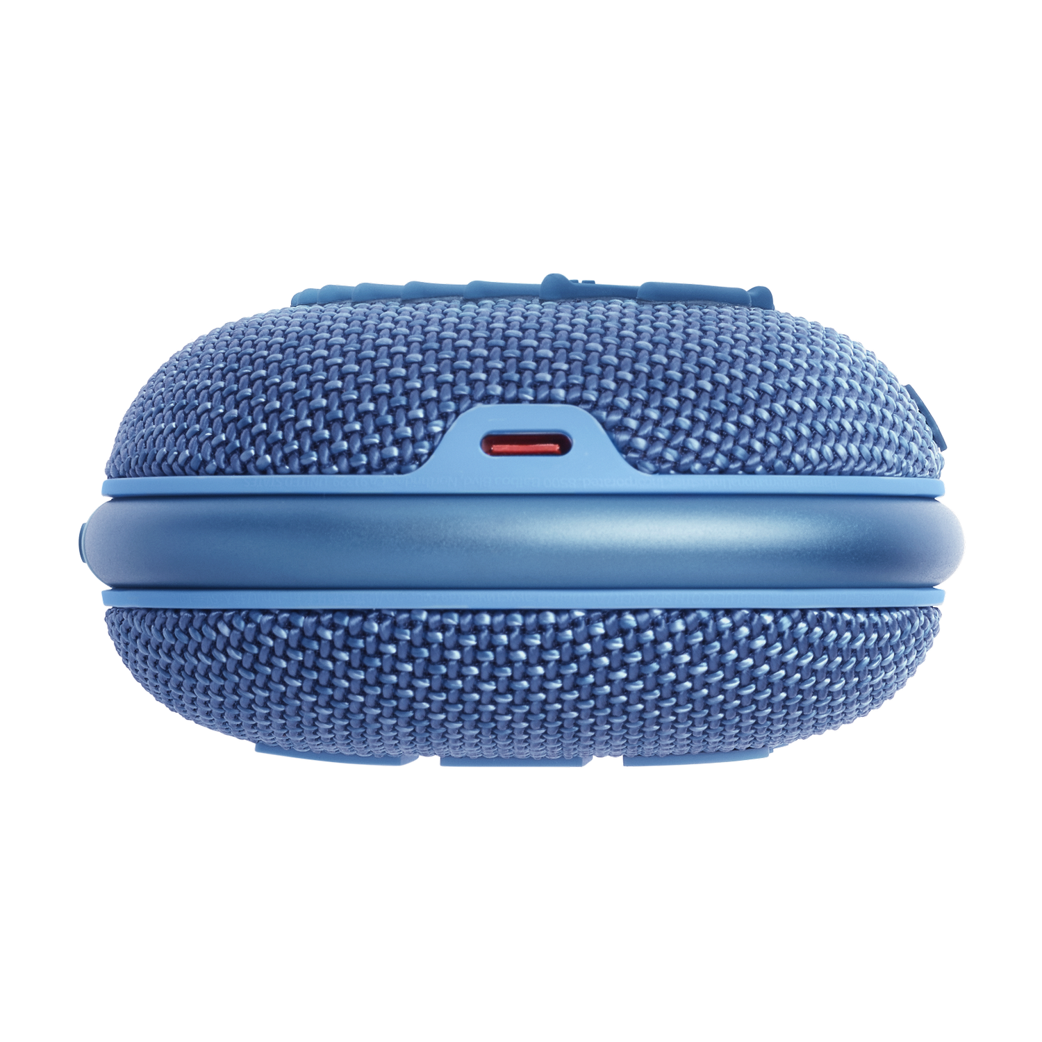 Niebieski głośnik pokryty tkaniną z czerwonym portem ładowania i niebieskim paskiem wokół niego.