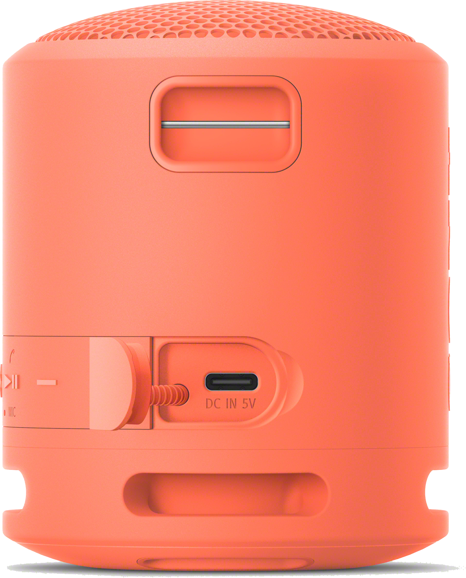 Głośnik w kolorze koralowym z siatkową górą i bocznym portem na kabel ładujący.
