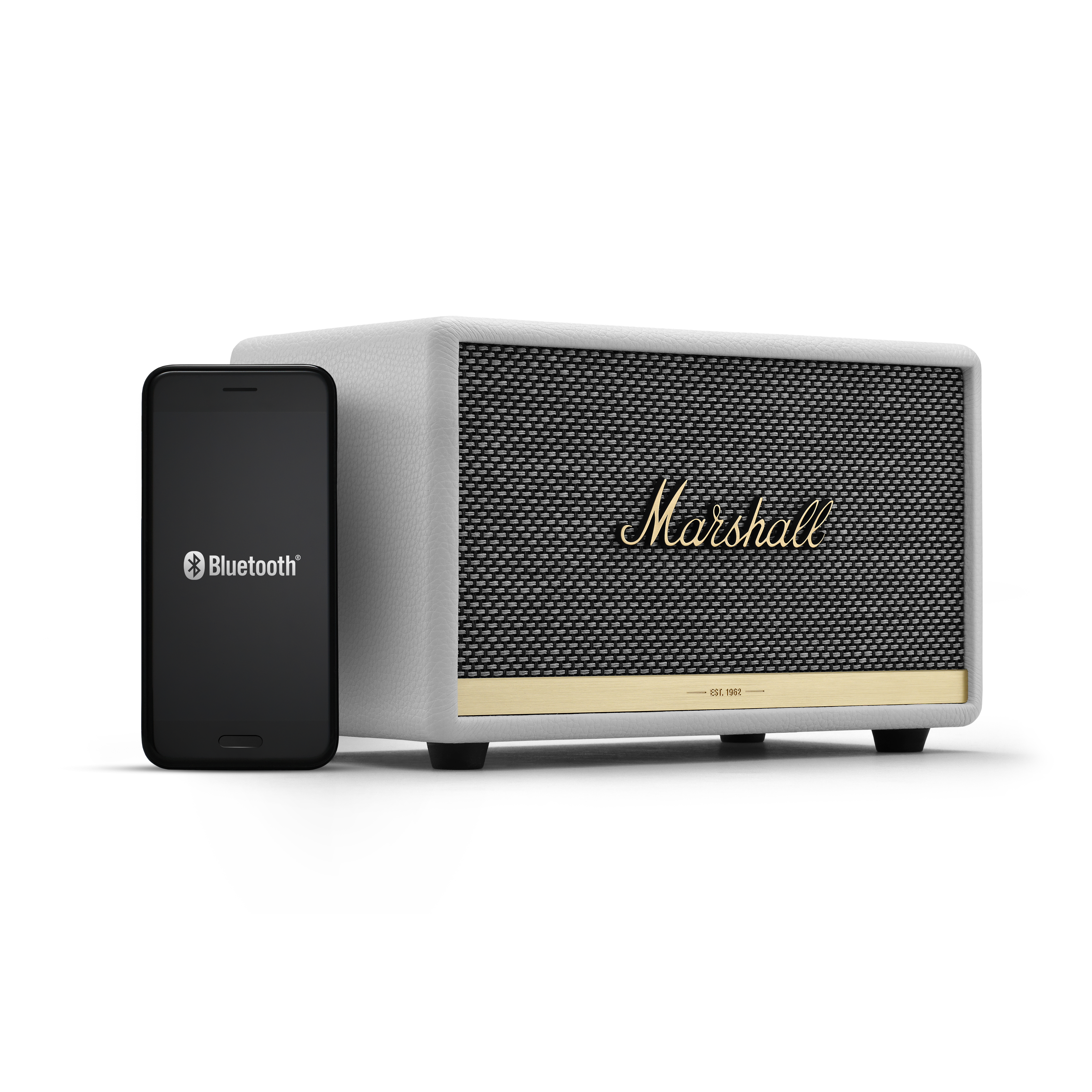 Weißer Marshall-Lautsprecher neben einem schwarzen Telefon mit Bluetooth-Logo.