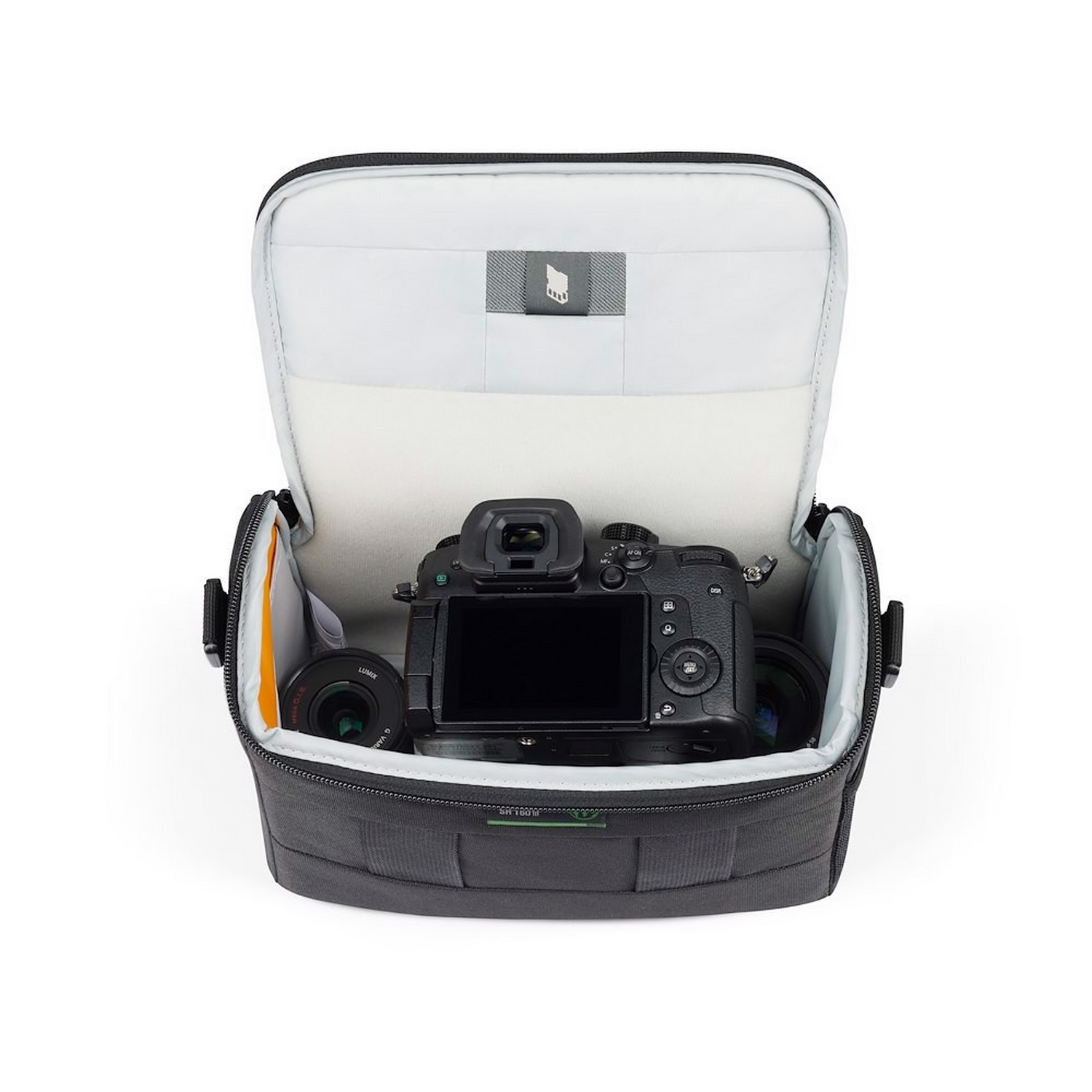 Camera and lenses inside a gray camera bag, open view.