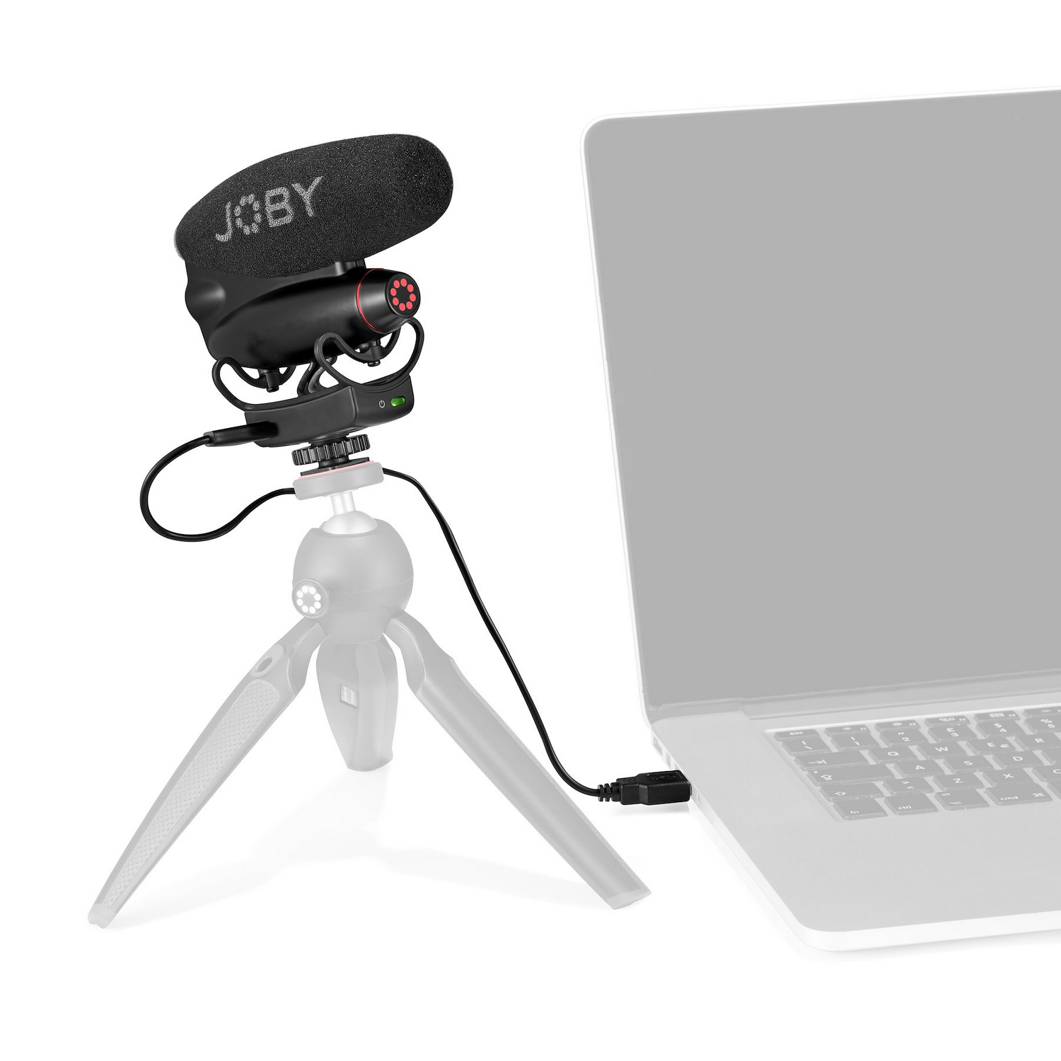 Ein Joby-Mikrofon auf einem Stativ, das über ein USB-Kabel mit einem Laptop verbunden ist.