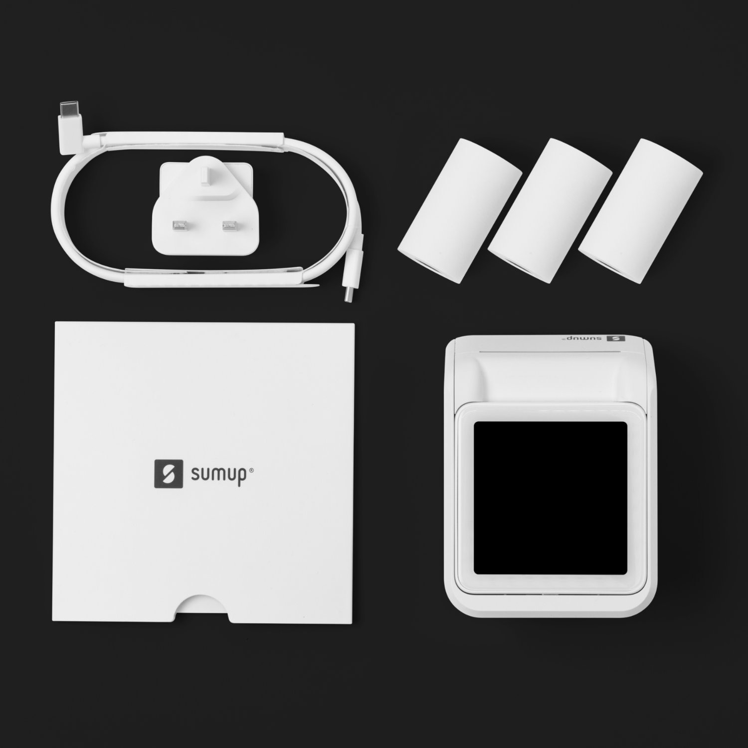 Dispositivo SumUp blanco y accesorios. Incluye cargador, cables y rollos de recibos.