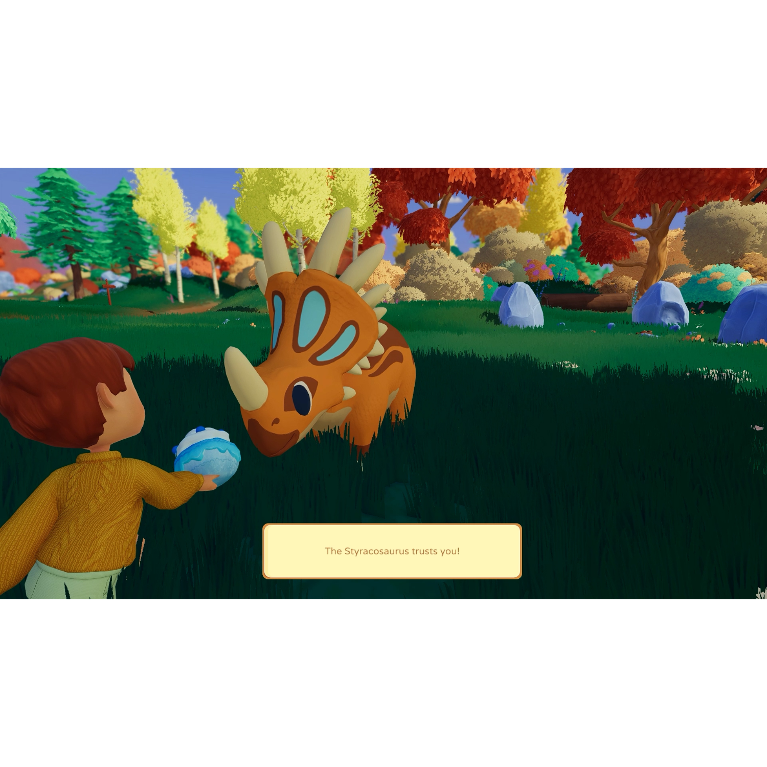 Spielszene: Ein Kind mit einem blauen Ei steht einem orangefarbenen Dinosaurier gegenüber, Text: „Das Styracosaurus vertraut dir!“.