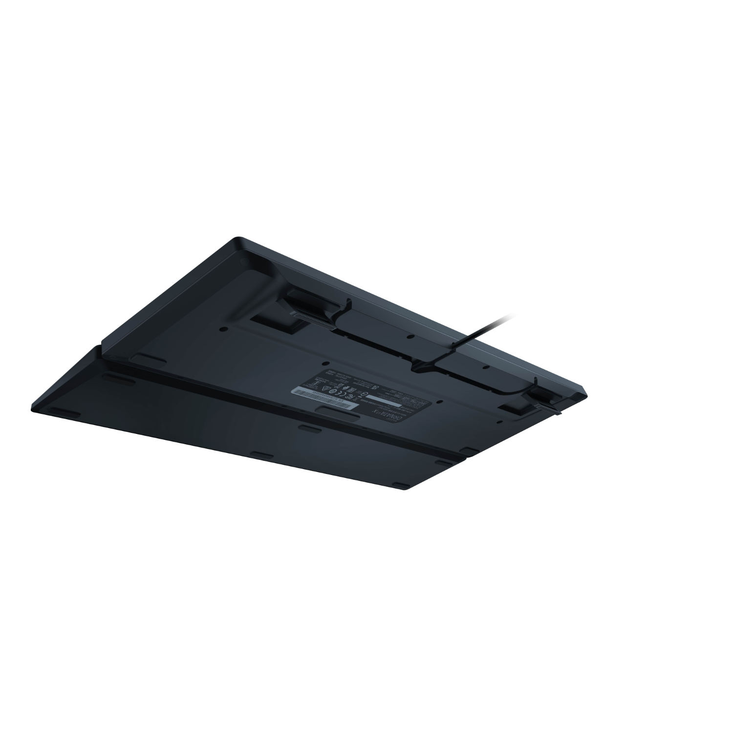 Spód czarnej klawiatury z kablem.