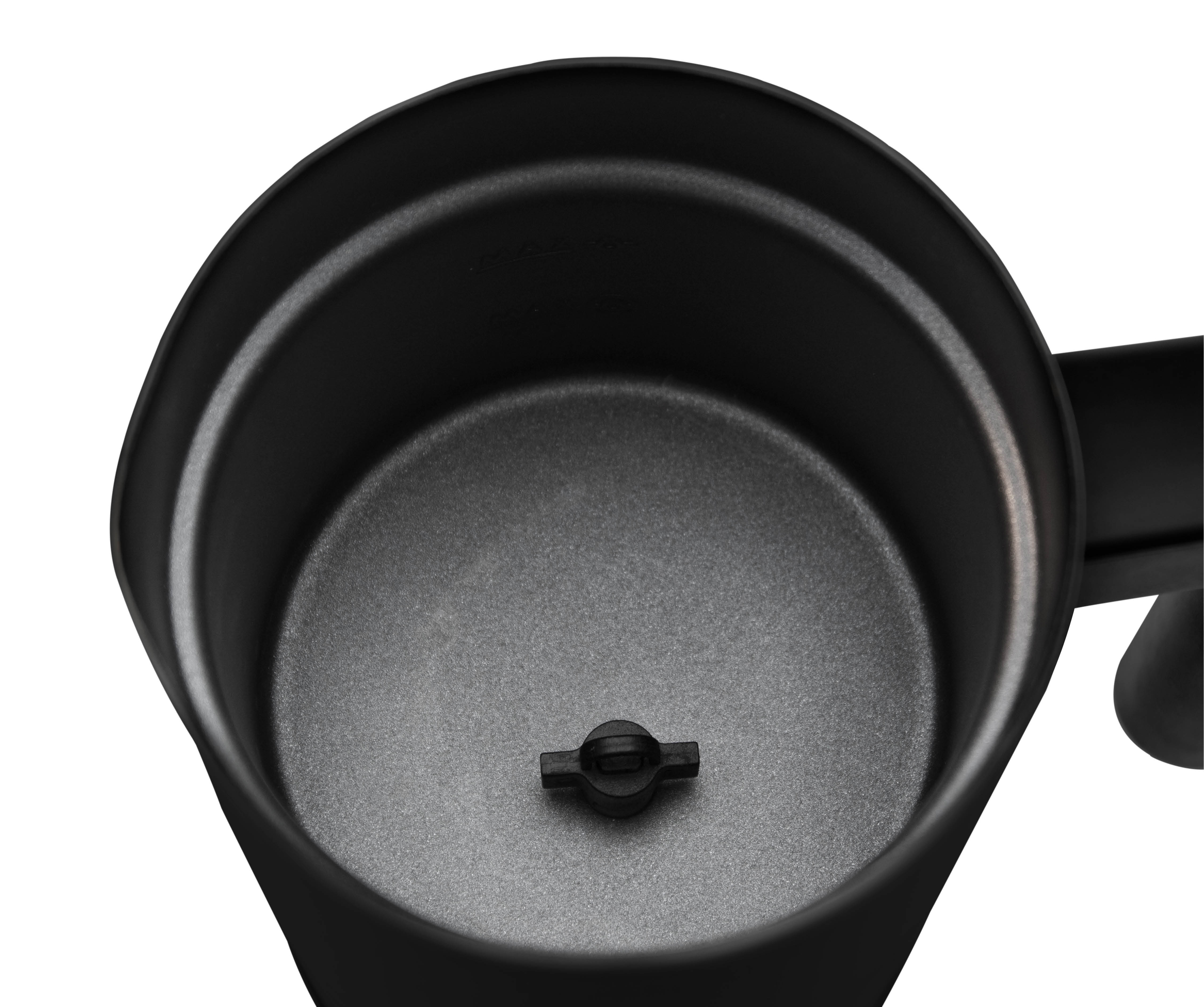 The interior of a black coffee machine, showing the brewing mechanism.