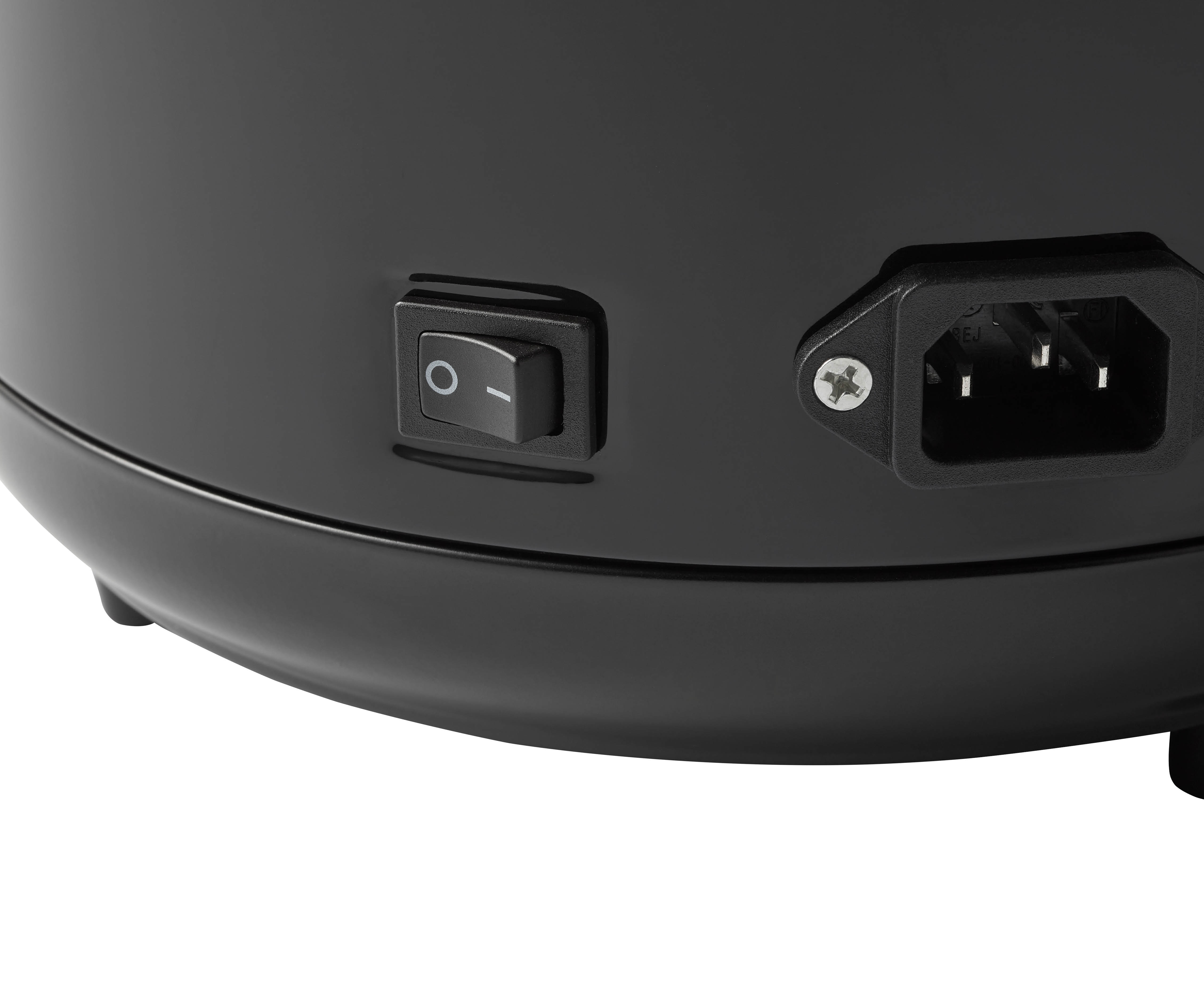 A close-up of the back of a black appliance with a power switch and power input.