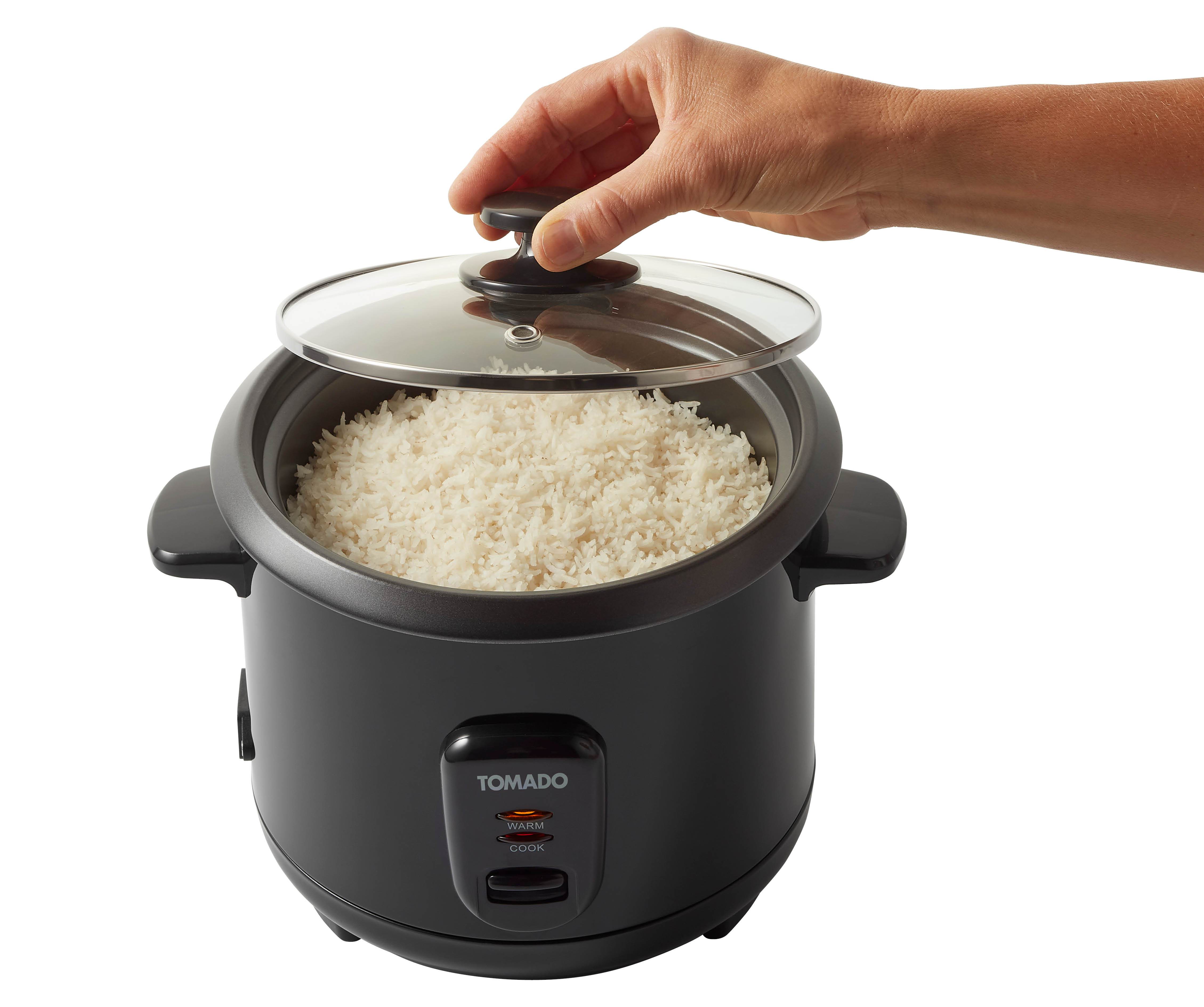 A person's hand lifting a glass lid off a rice cooker filled with white rice.