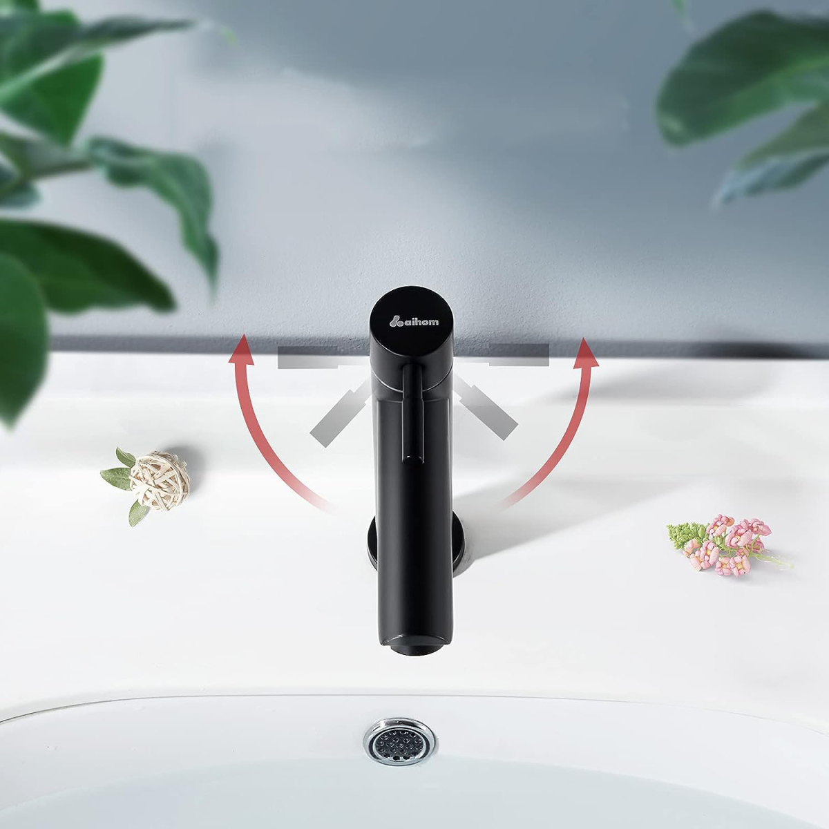 Schwarzer Wasserhahn mit roten Pfeilen, die den Wasserfluss anzeigen, mit weißem Waschbecken.