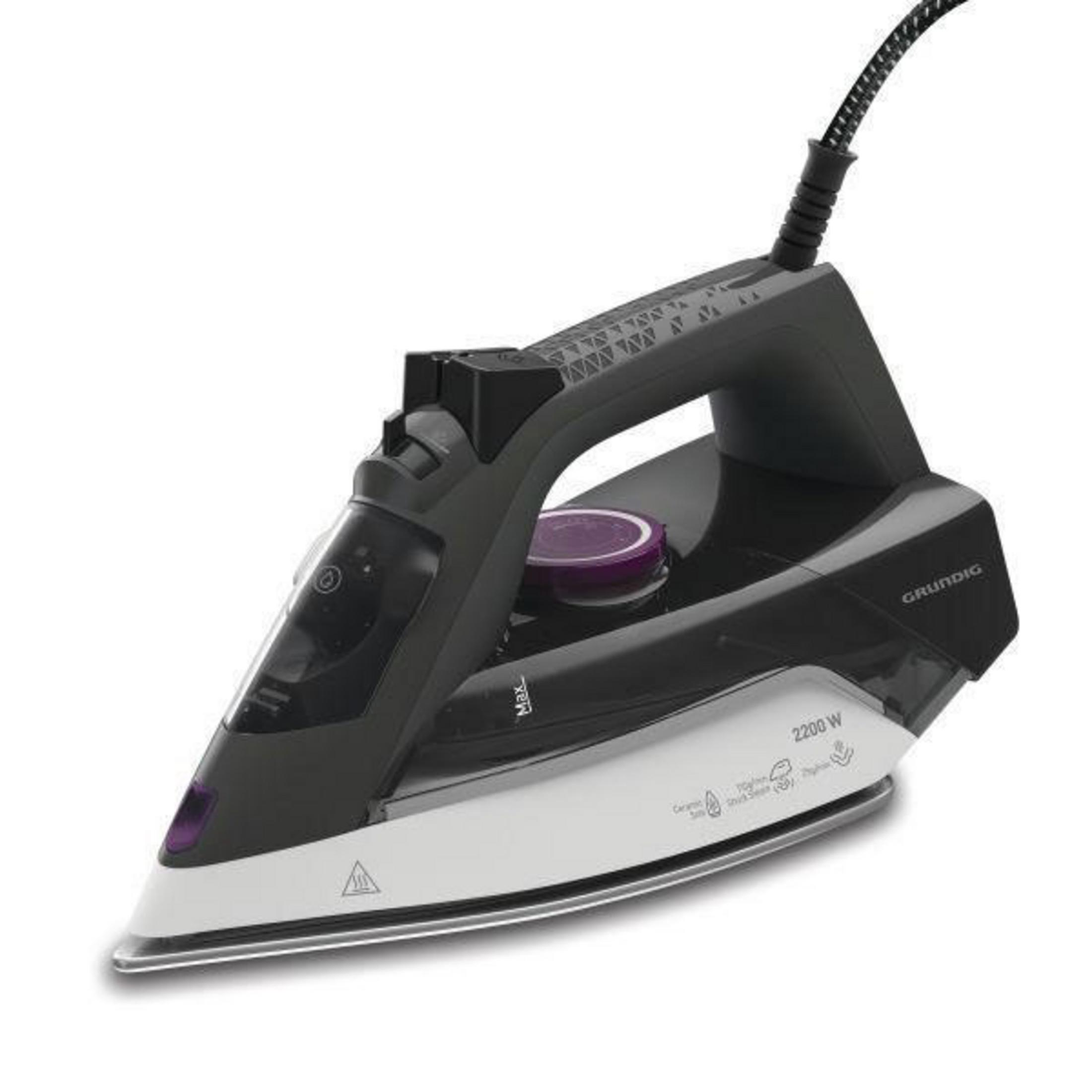 Czarne i białe żelazko z fioletowym pokrętłem, na białej powierzchni.