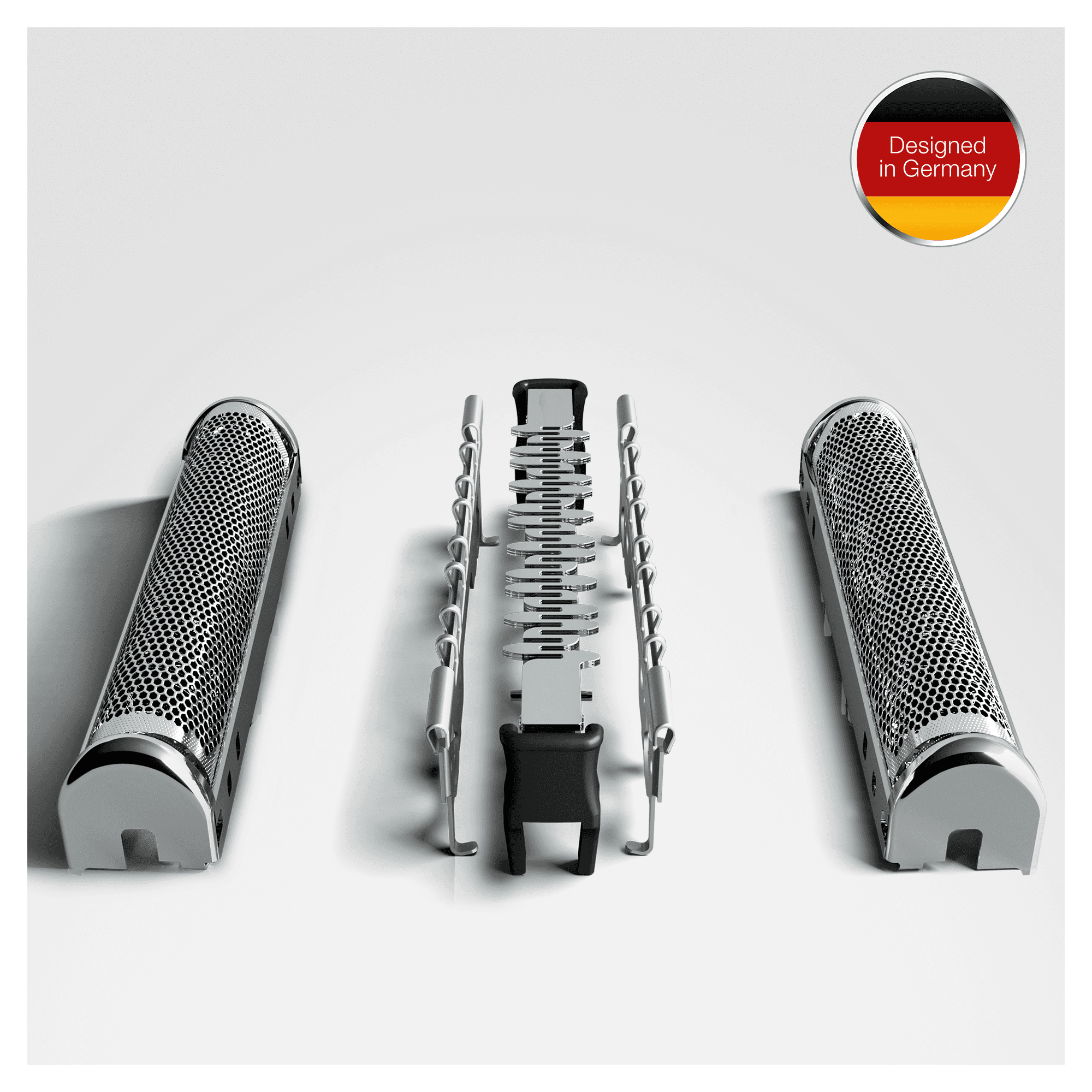 Trzy srebrno-czarne części golarki na białym tle. Niemiecka flaga i tekst 'Designed in Germany'.