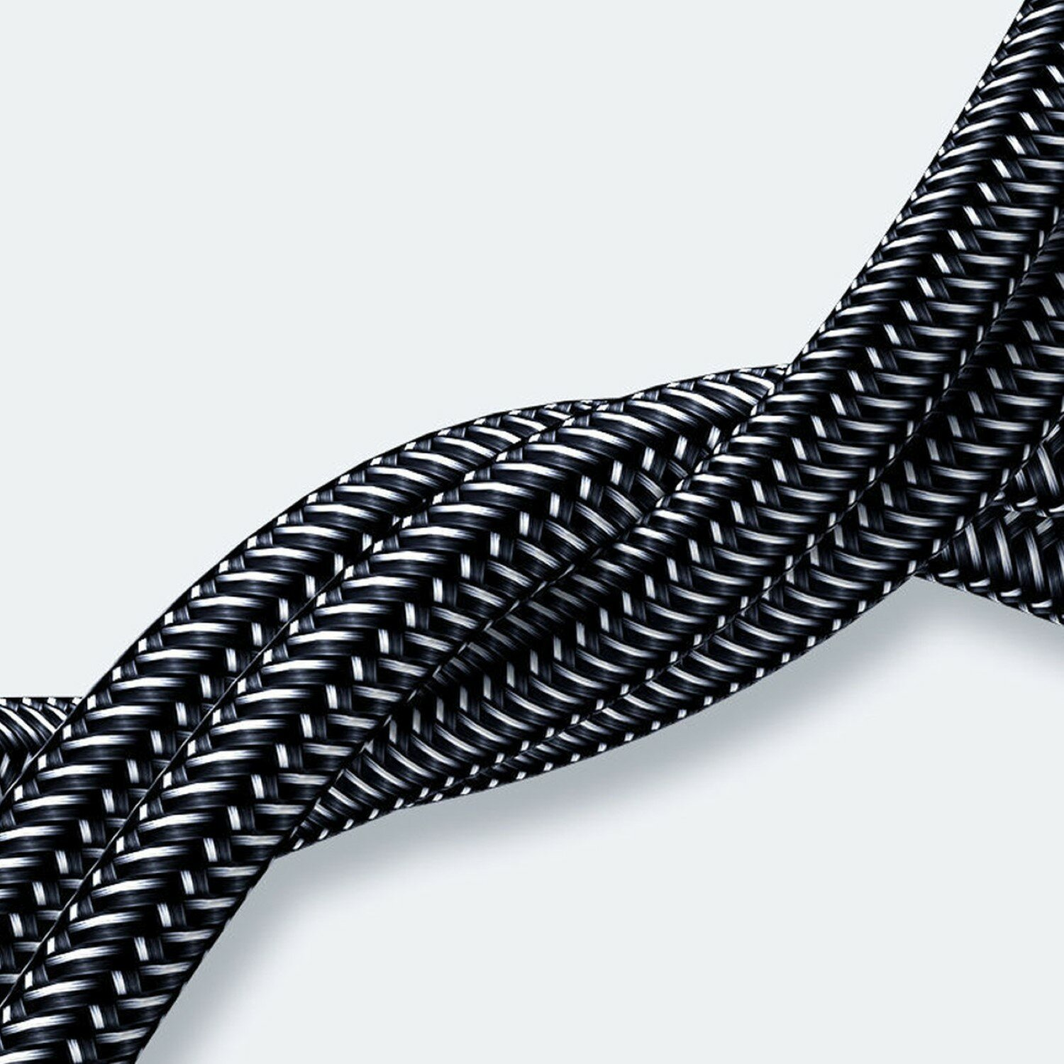 Geflochtenes schwarz-weißes Kabel, das auf weißem Hintergrund zusammengedreht ist.