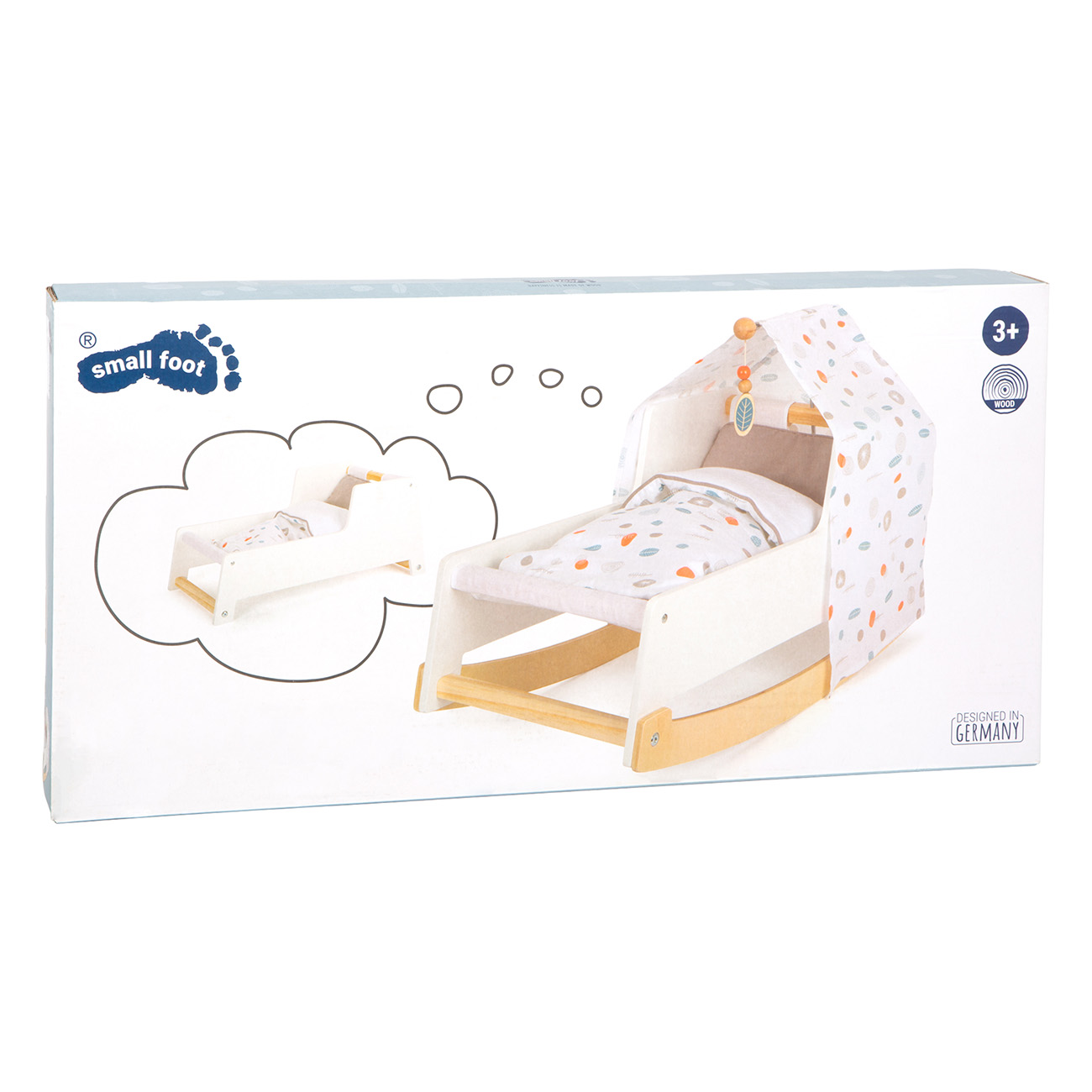 Eine weiße Box mit einer Babybett-Illustration und einem echten Bettchen darin. Das Bett hat ein Verdeck.