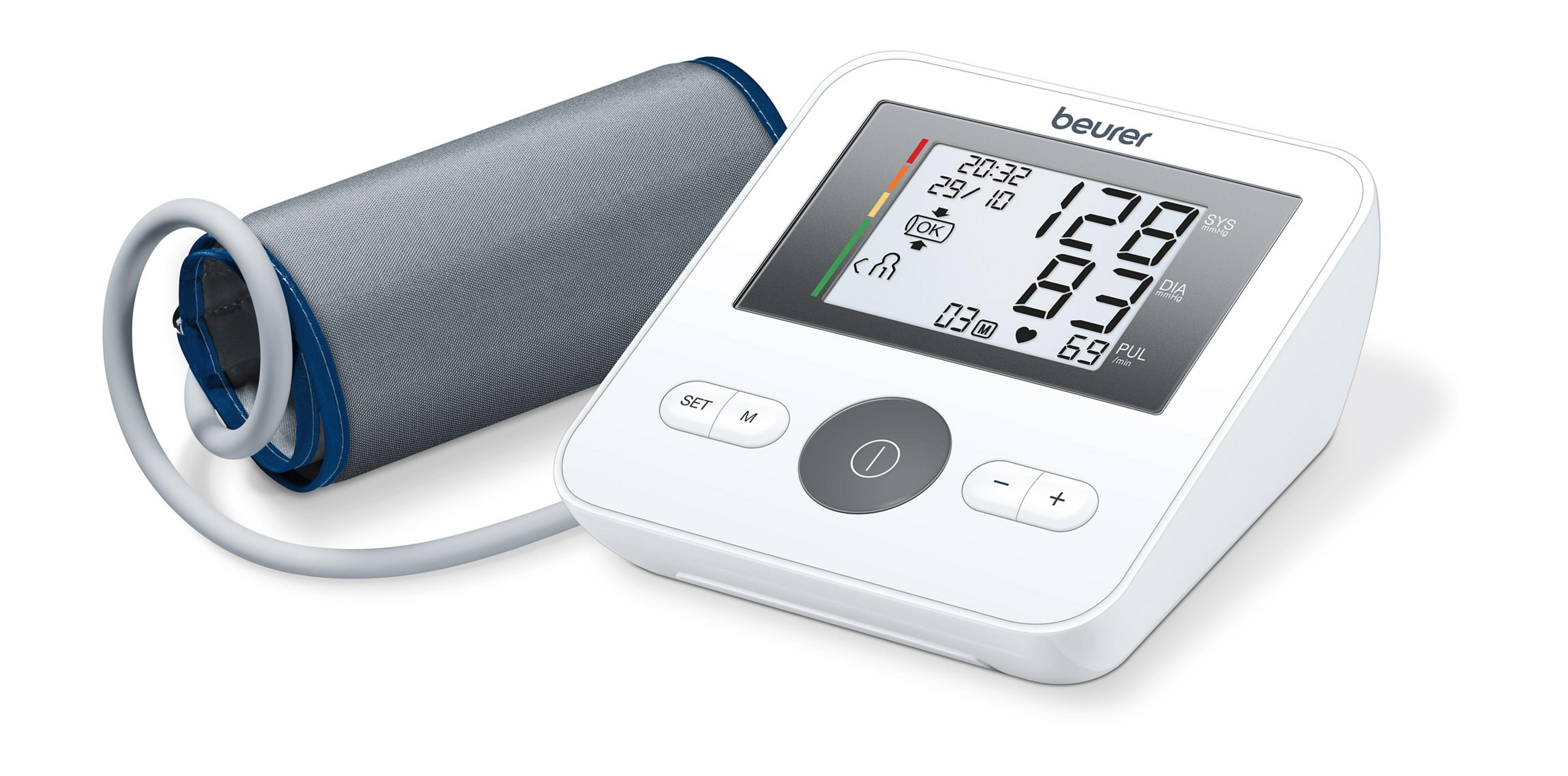 White digital blood pressure monitor with a cuff. The display shows readings. The background is white.