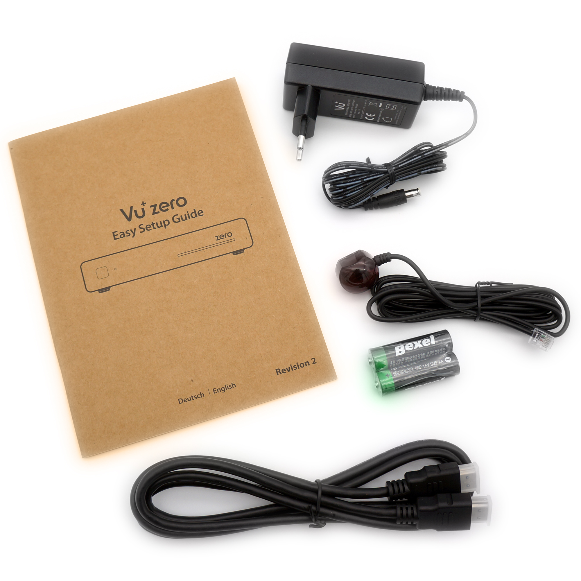 Vu Zero-Setup-Anleitung mit Zubehör, einschließlich Netzteil, Fernbedienungsempfänger und Kabeln.