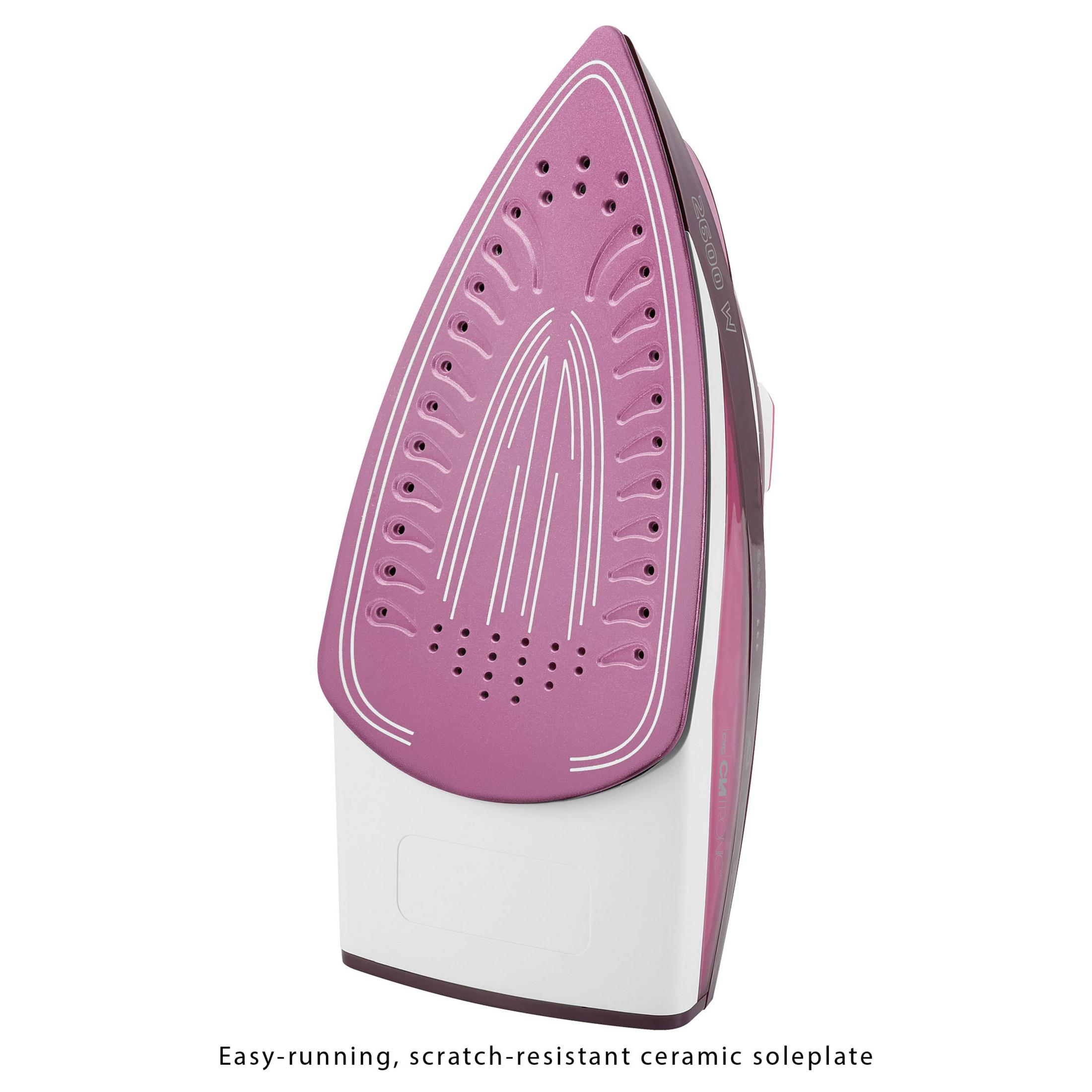 Różowe żelazko, widok od dołu. Białe linie, biała podstawa.