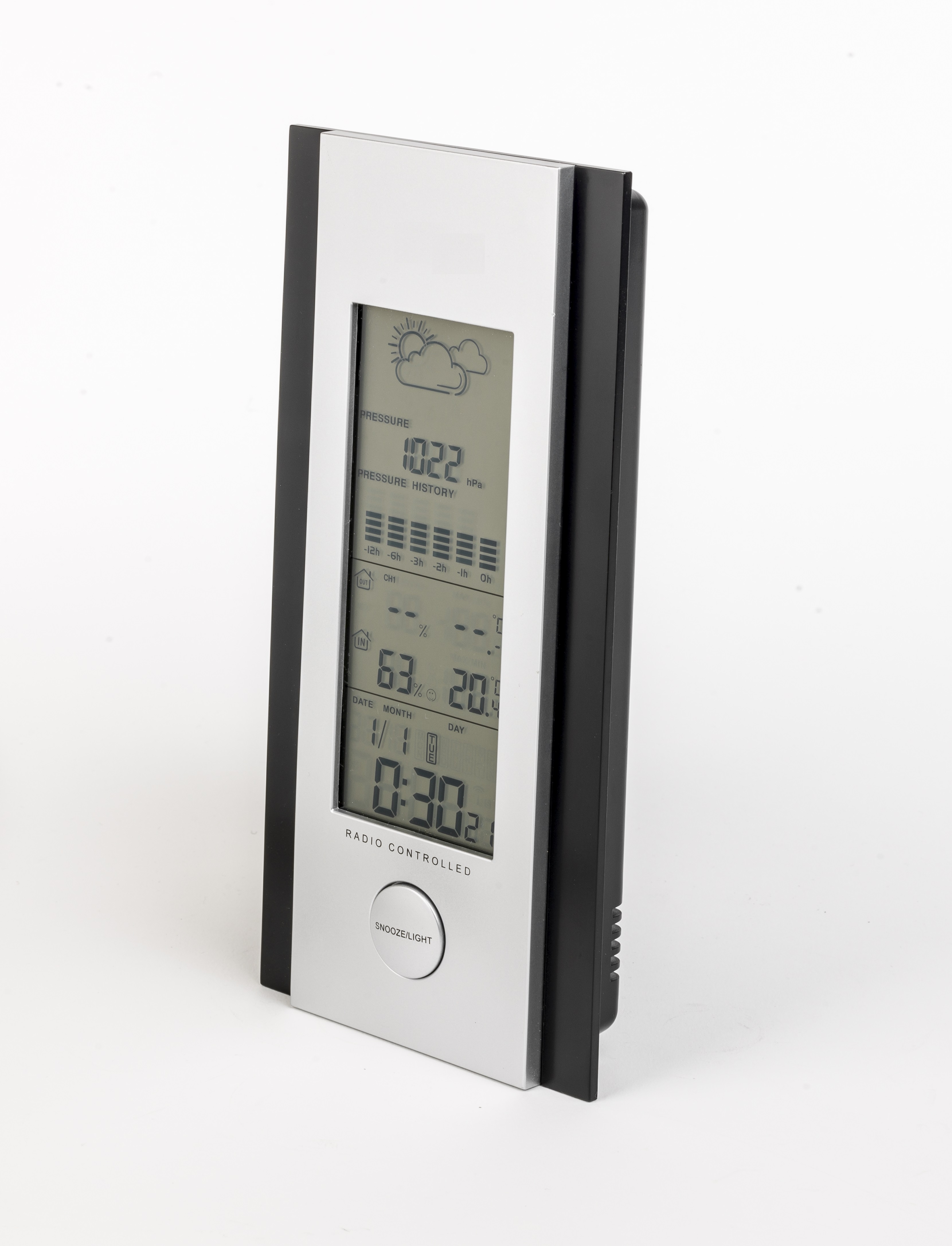 Digital weather station showing pressure, history, and time. Silver and black frame.