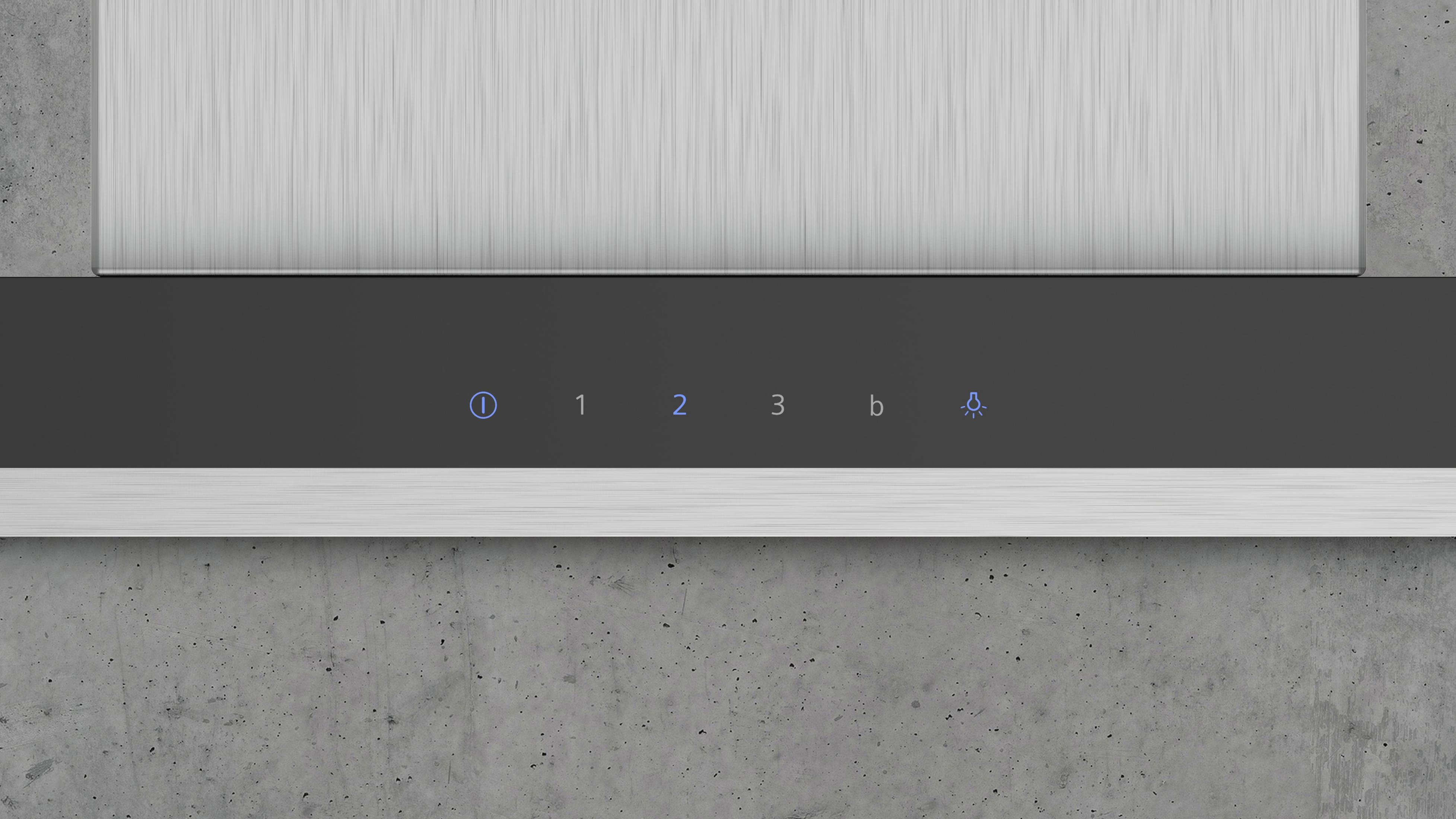 Primo piano di un pannello di controllo con 3 pulsanti e un indicatore luminoso.