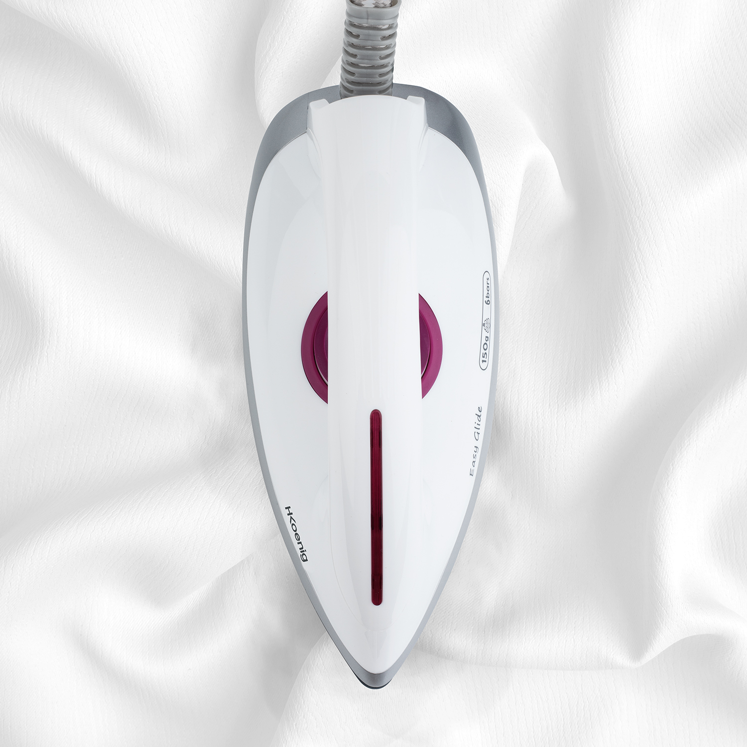 Un ferro da stiro bianco con un accento viola e una linea rossa su un tessuto bianco.