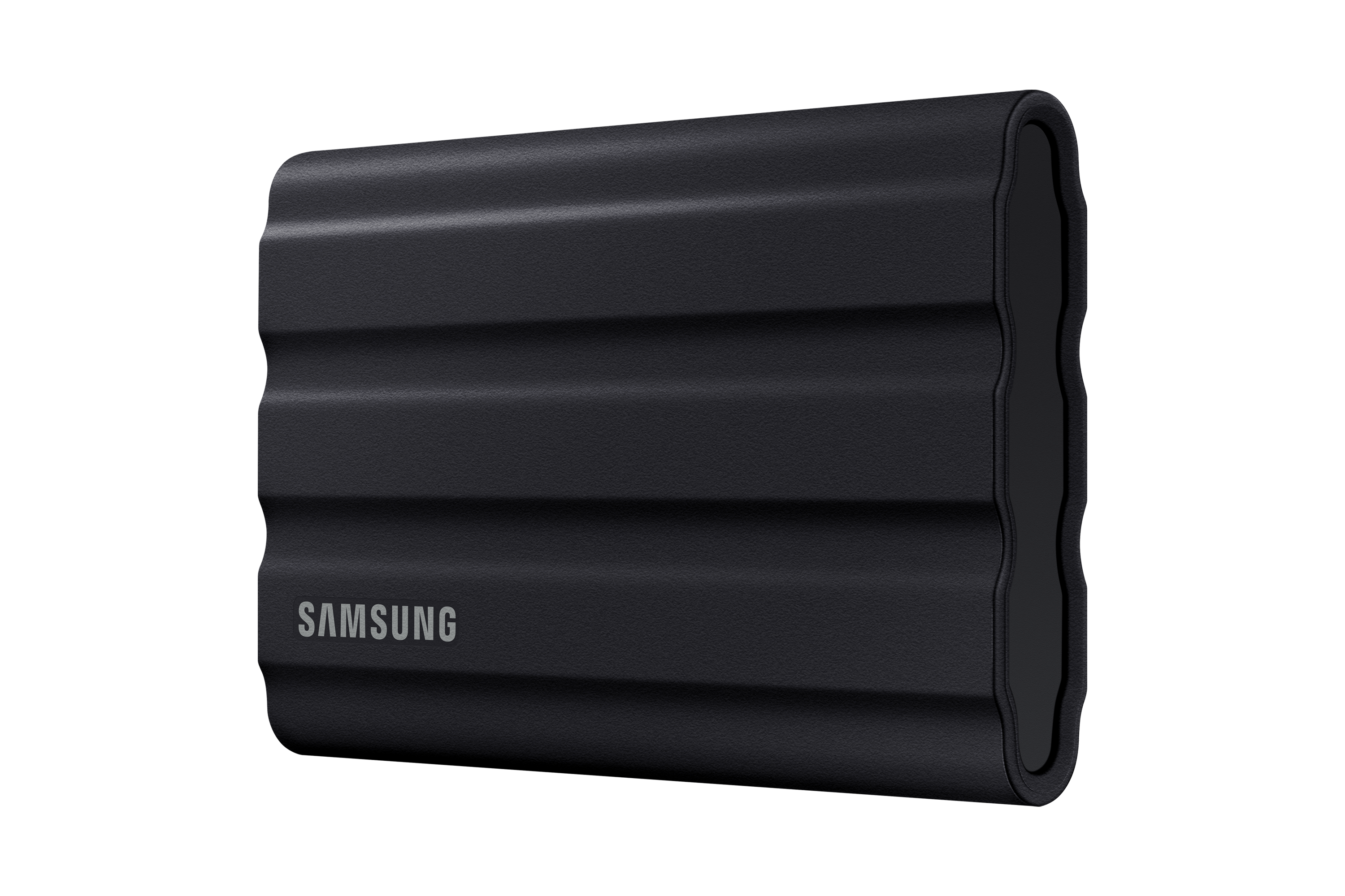 Czarny, żebrowany przenośny dysk SSD Samsung. Logo Samsung jest widoczne.