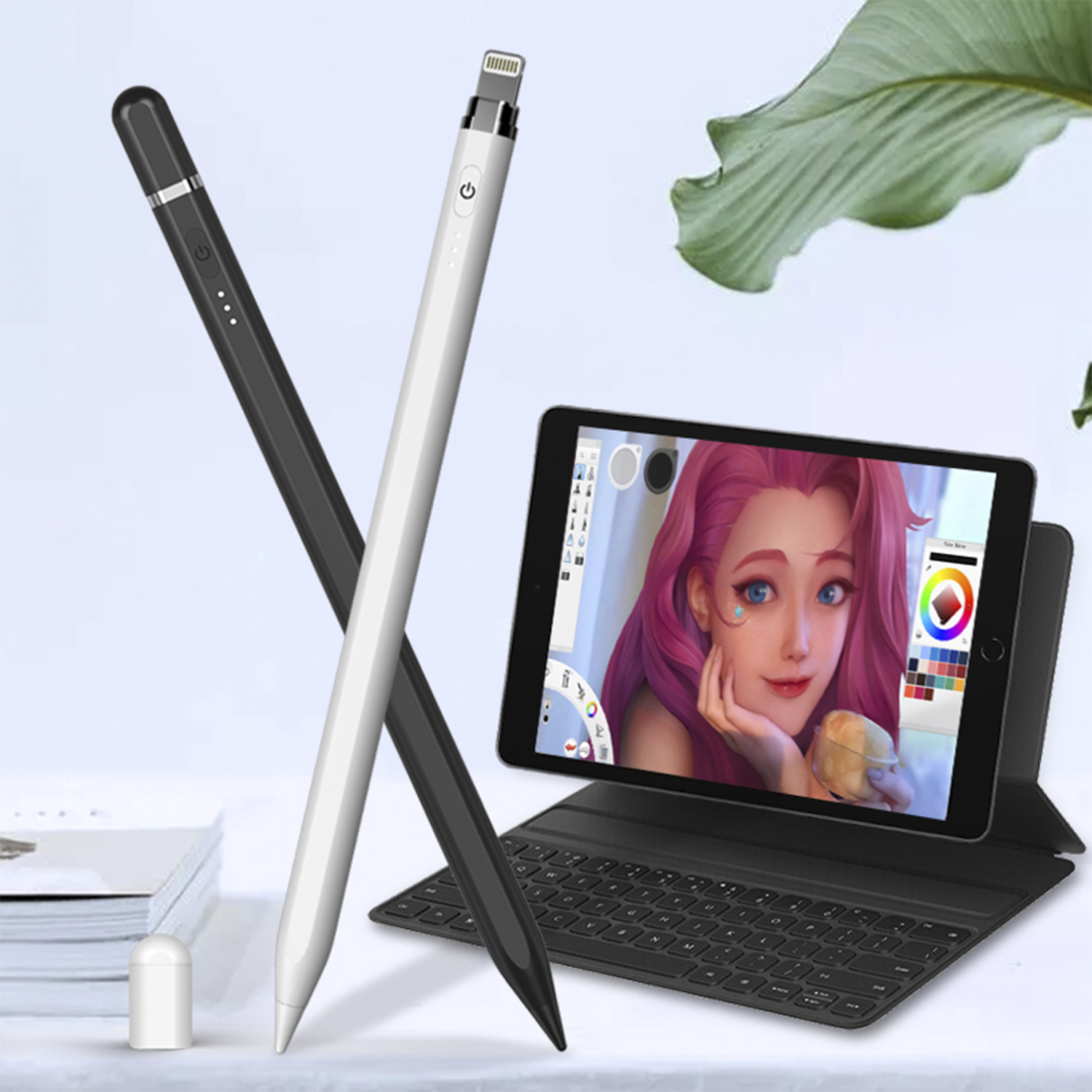 Dos lápices ópticos: negro y blanco, y una tableta que muestra una obra de arte digital con un teclado.