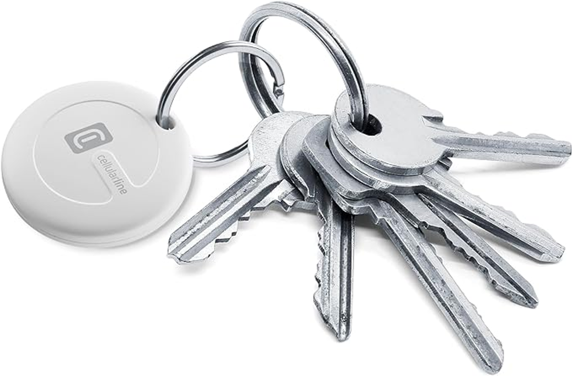 Brelok do kluczy z białą zawieszką cellularline i kilkoma srebrnymi kluczami.