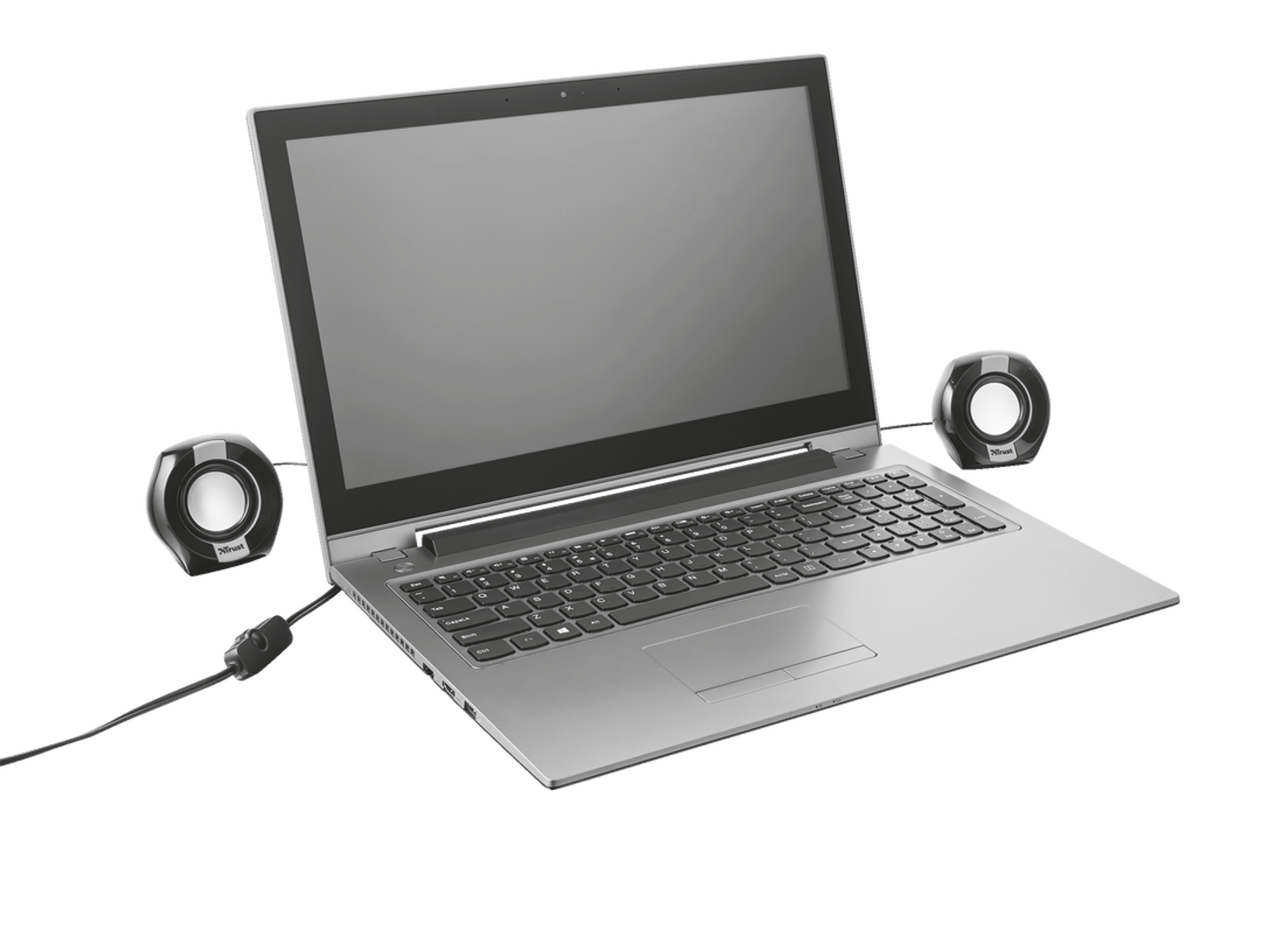 Laptop z dwoma małymi głośnikami po obu stronach. Czarne tło.