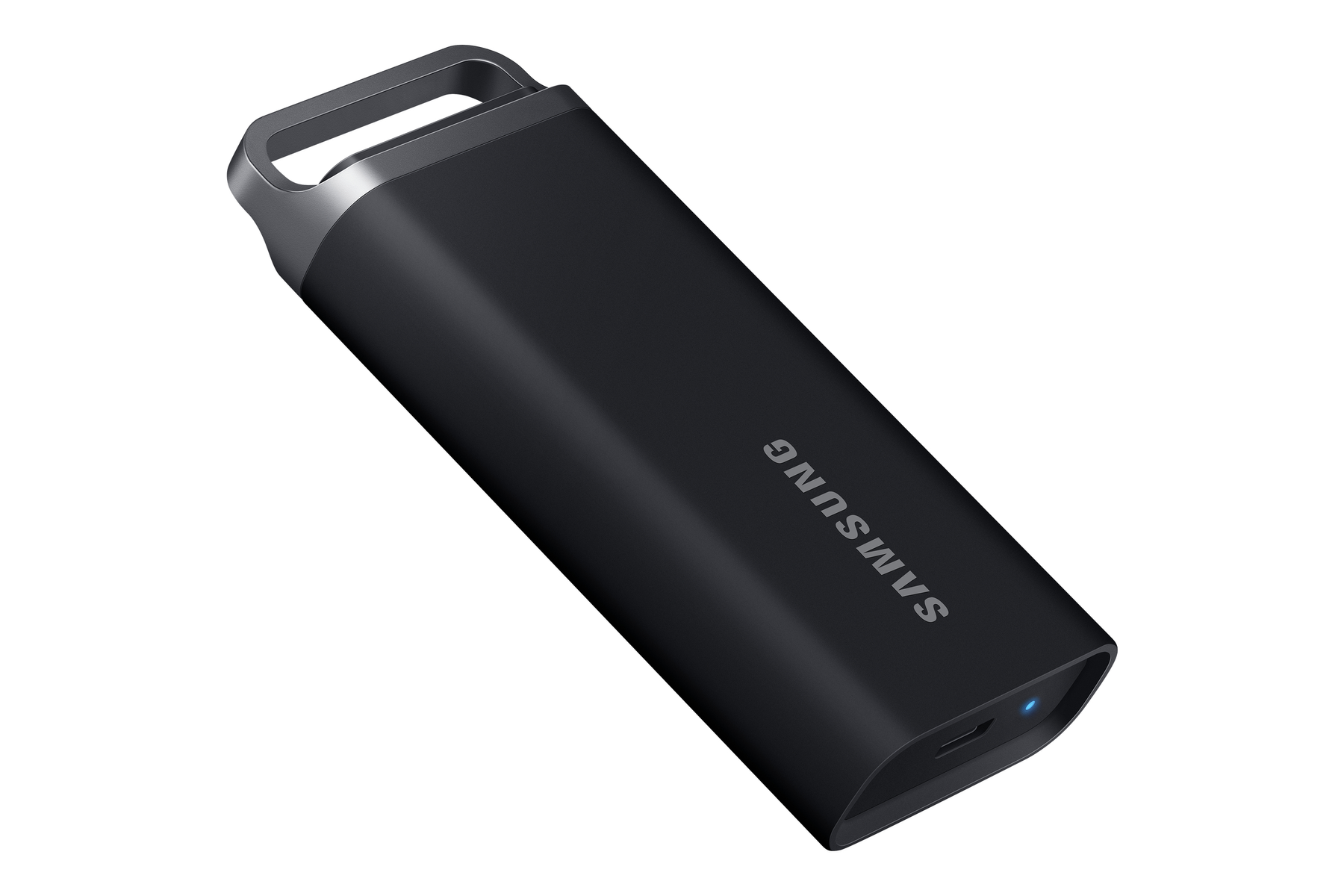 Czarny pendrive Samsung z srebrną pętlą. Logo Samsung jest na nim nadrukowane. Czarne tło.