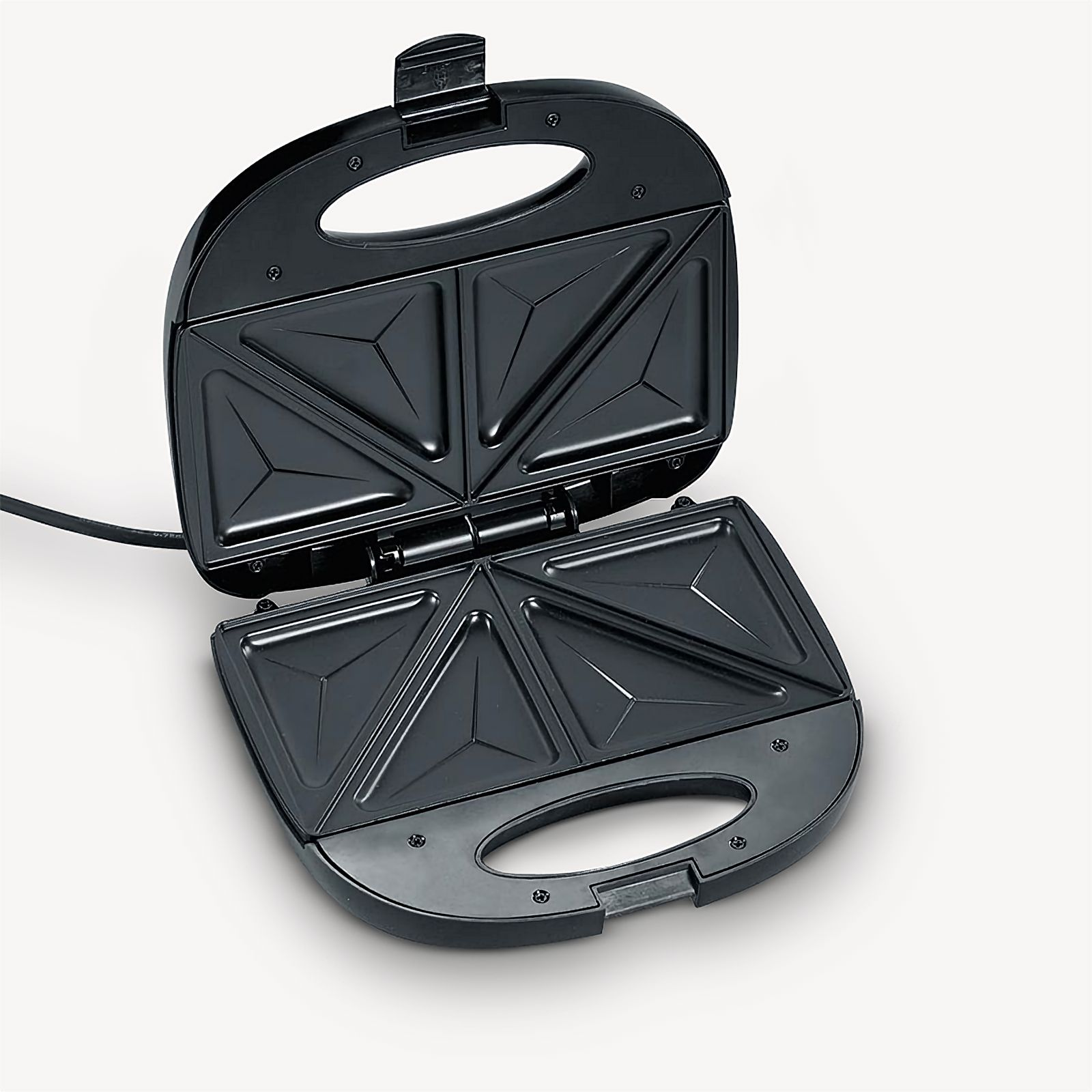 An open black sandwich maker with triangle-shaped molds.