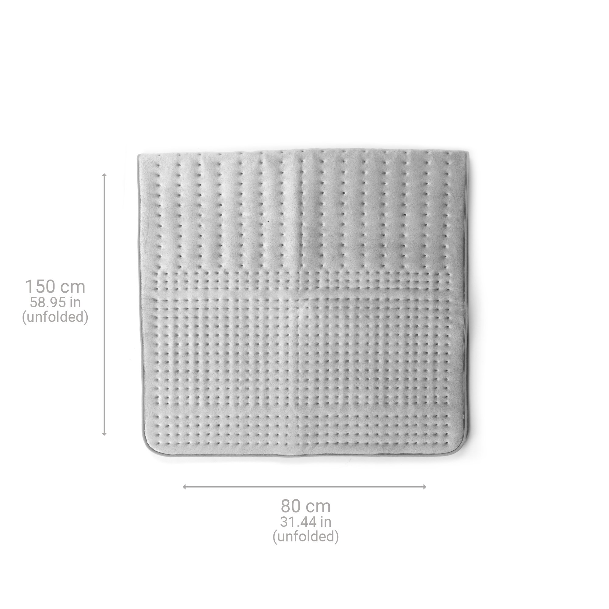 A light gray heating pad, unfolded, with dimensions labeled in cm and inches on a white surface.
