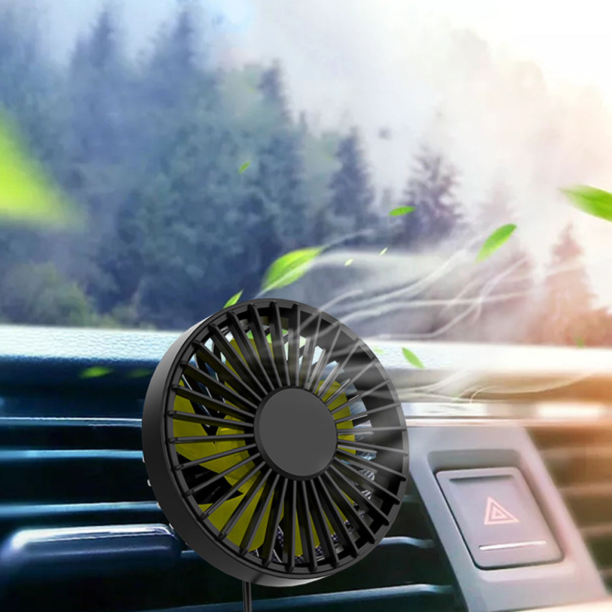 Ein schwarz-gelber Autolüfter ist in einem Auto montiert. Grüne Blätter schweben in der Luft.