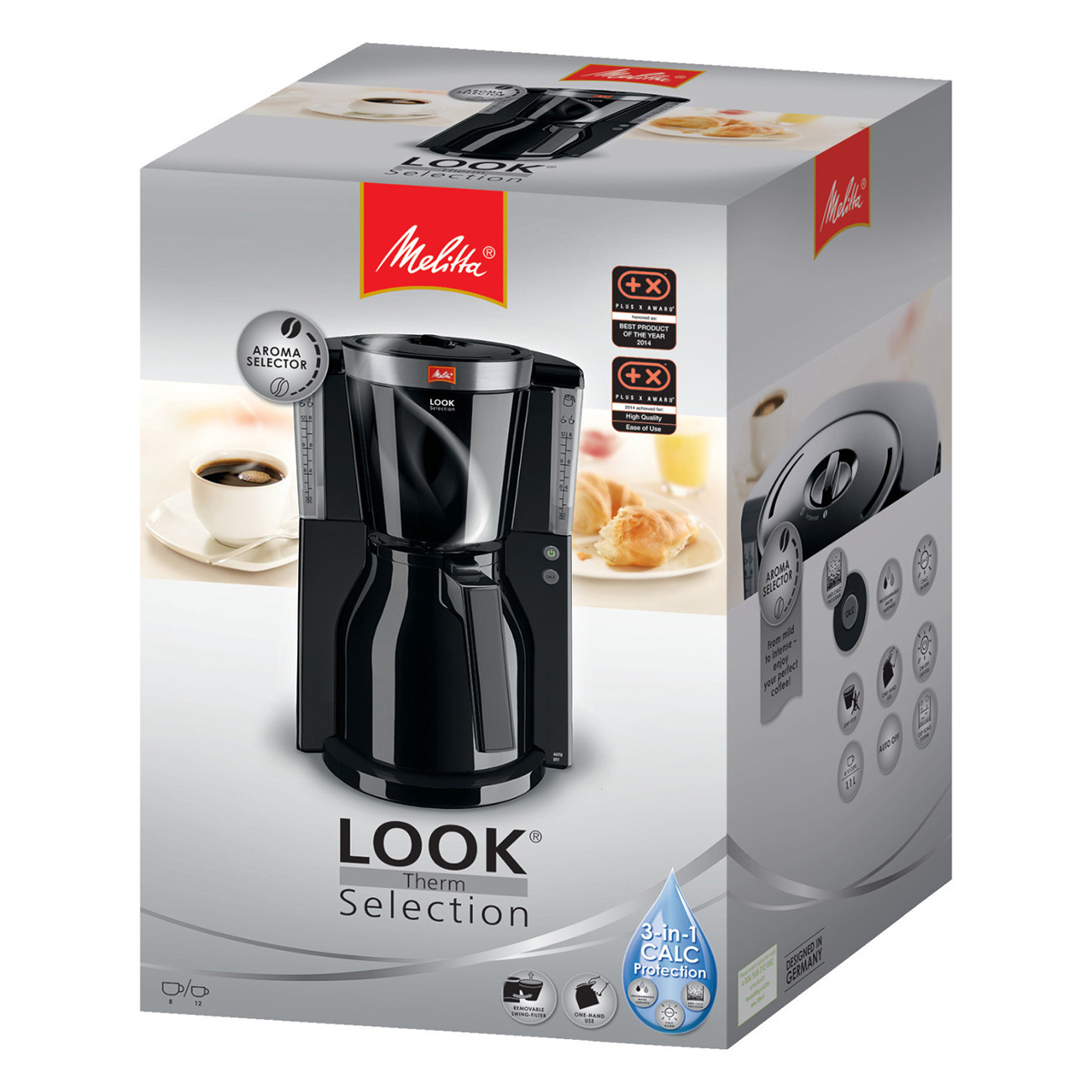 Una cafetera Melitta negra en su caja, con una taza de café y un cruasán al lado.