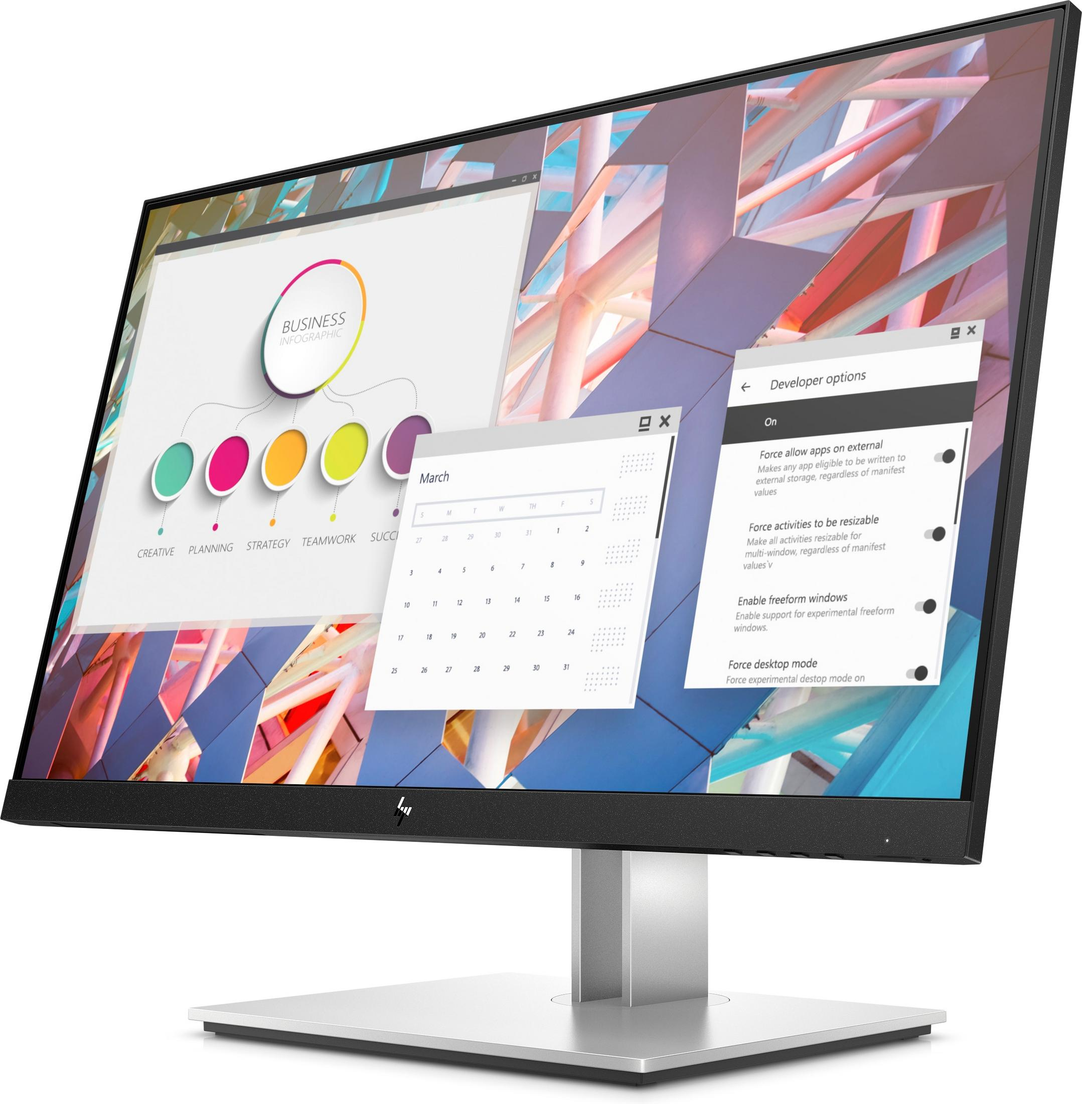 A computer monitor showing a business-related presentation and developer options, in an office setting.