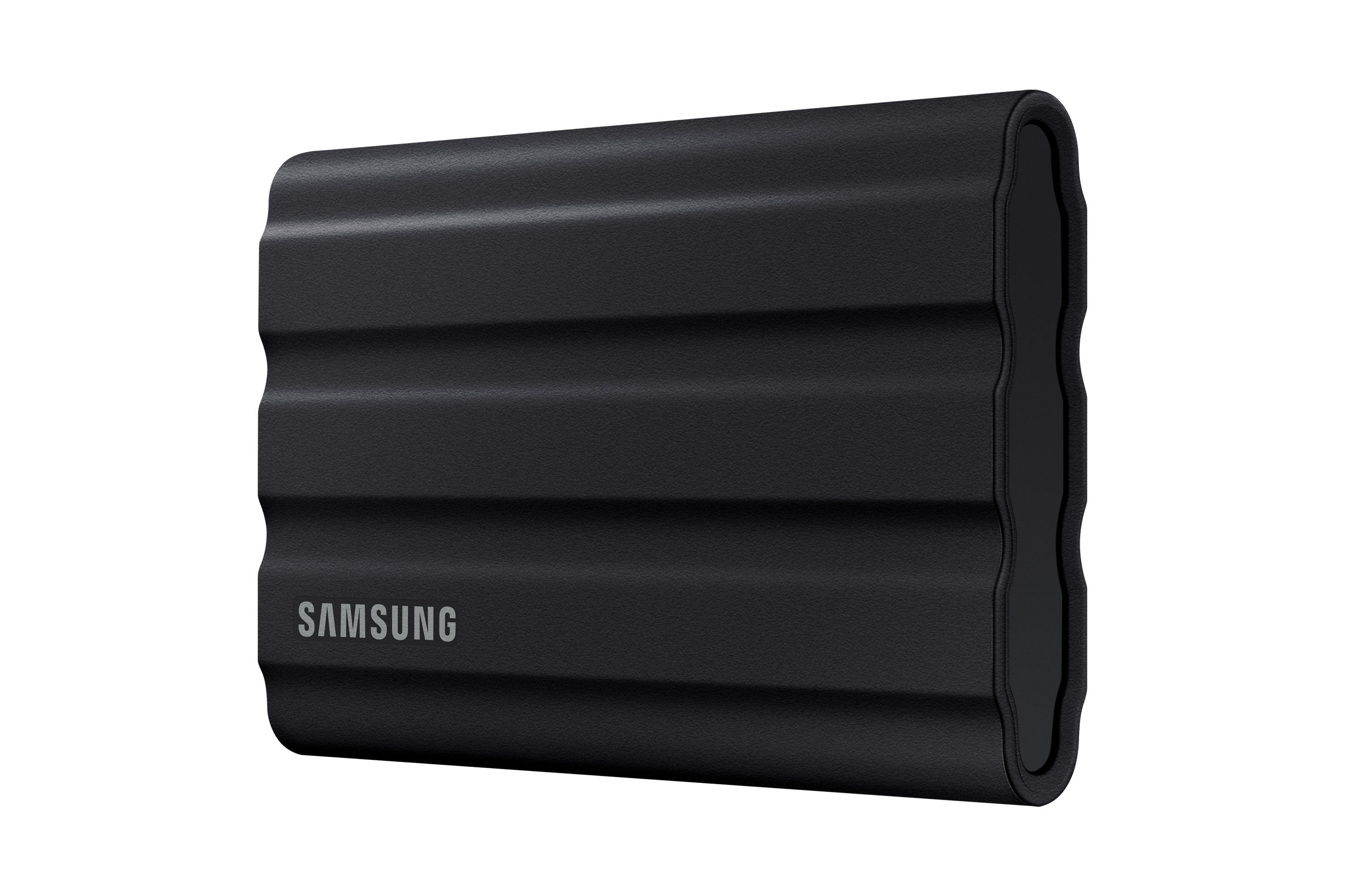 SSD externe noir, texturé en forme de vagues, avec logo SAMSUNG sur fond noir.