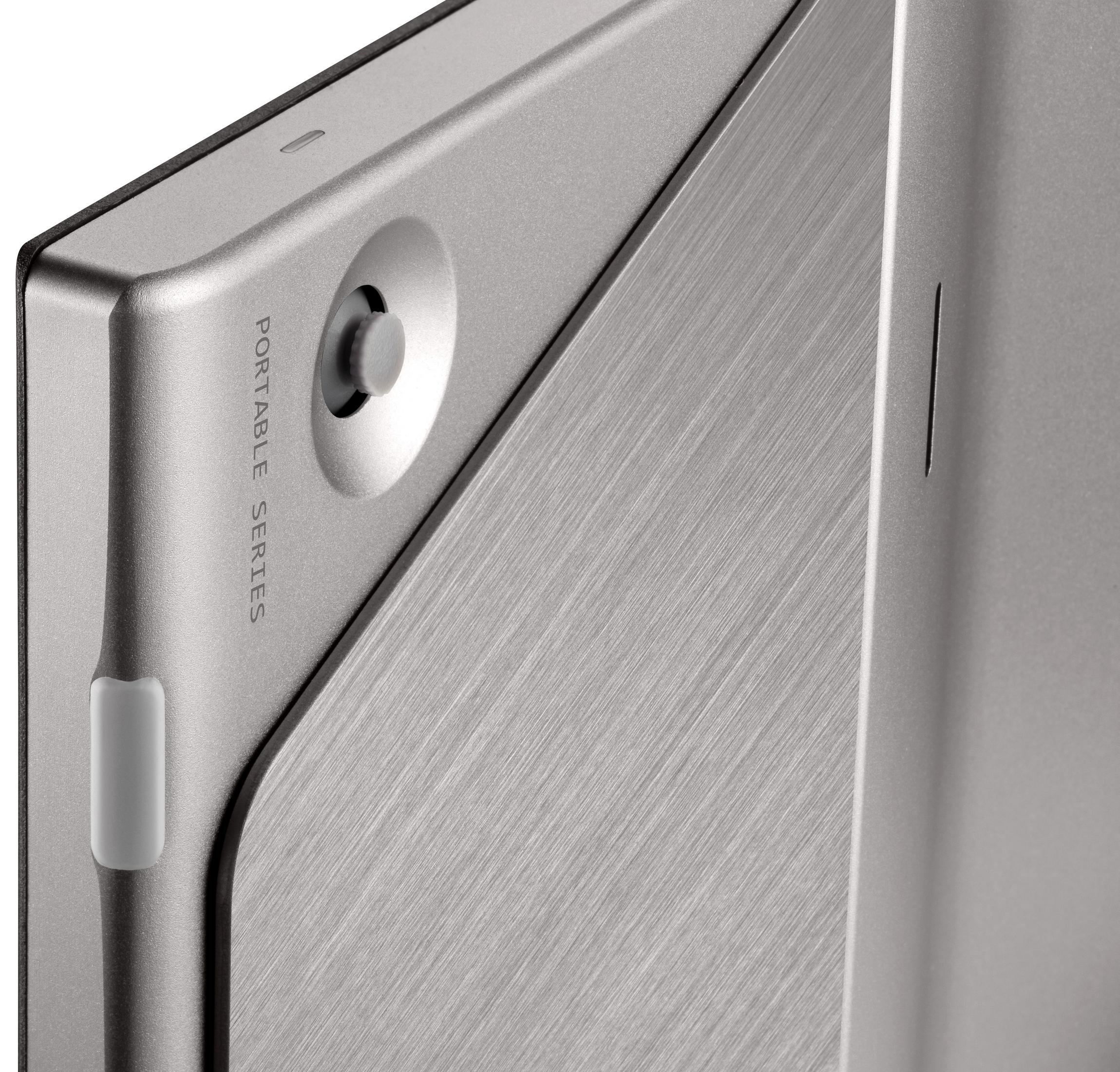 Appareil portable argenté avec un bouton et les mots : Portable Series.