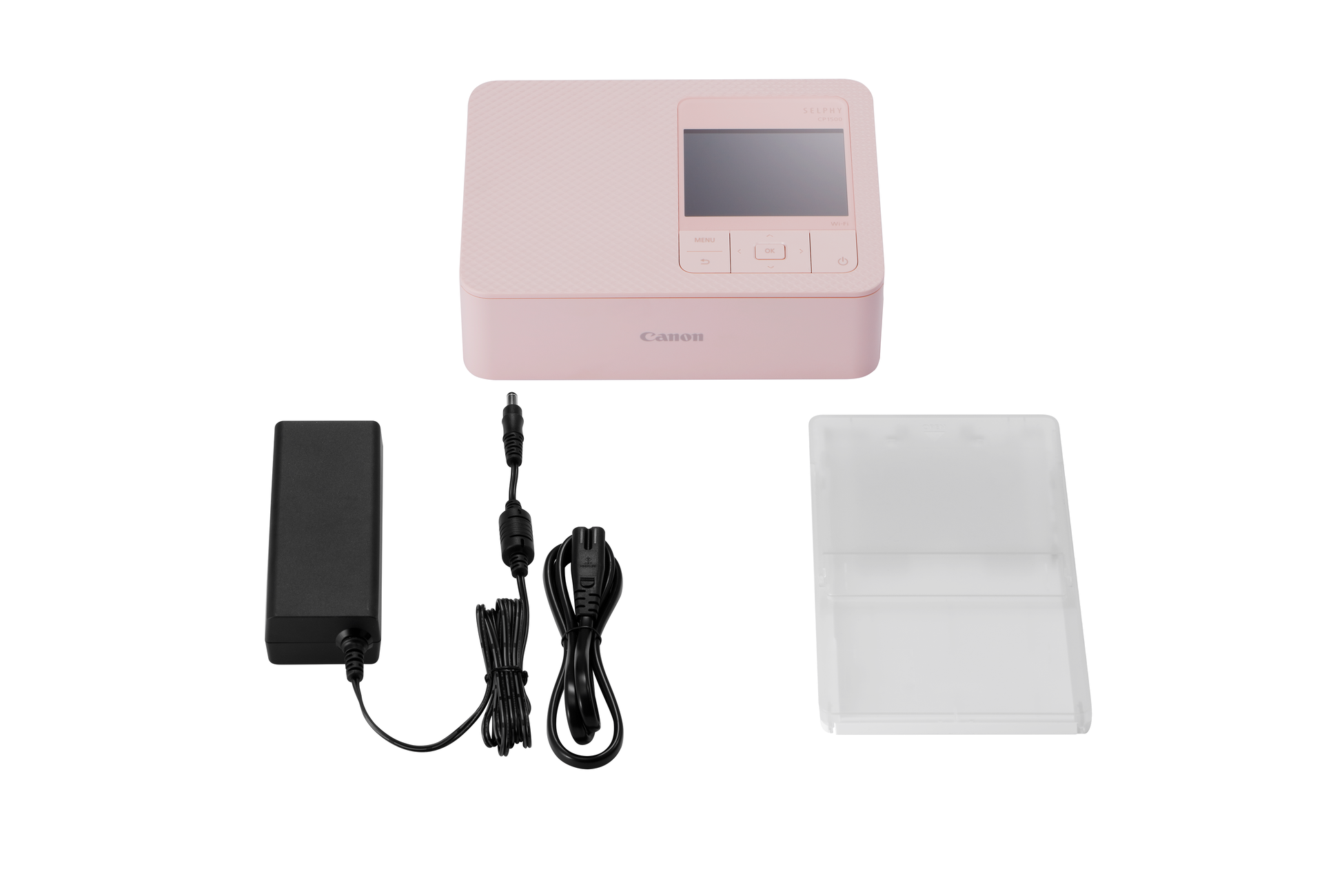 Różowa drukarka fotograficzna Canon Selphy z akcesoriami na białym tle.