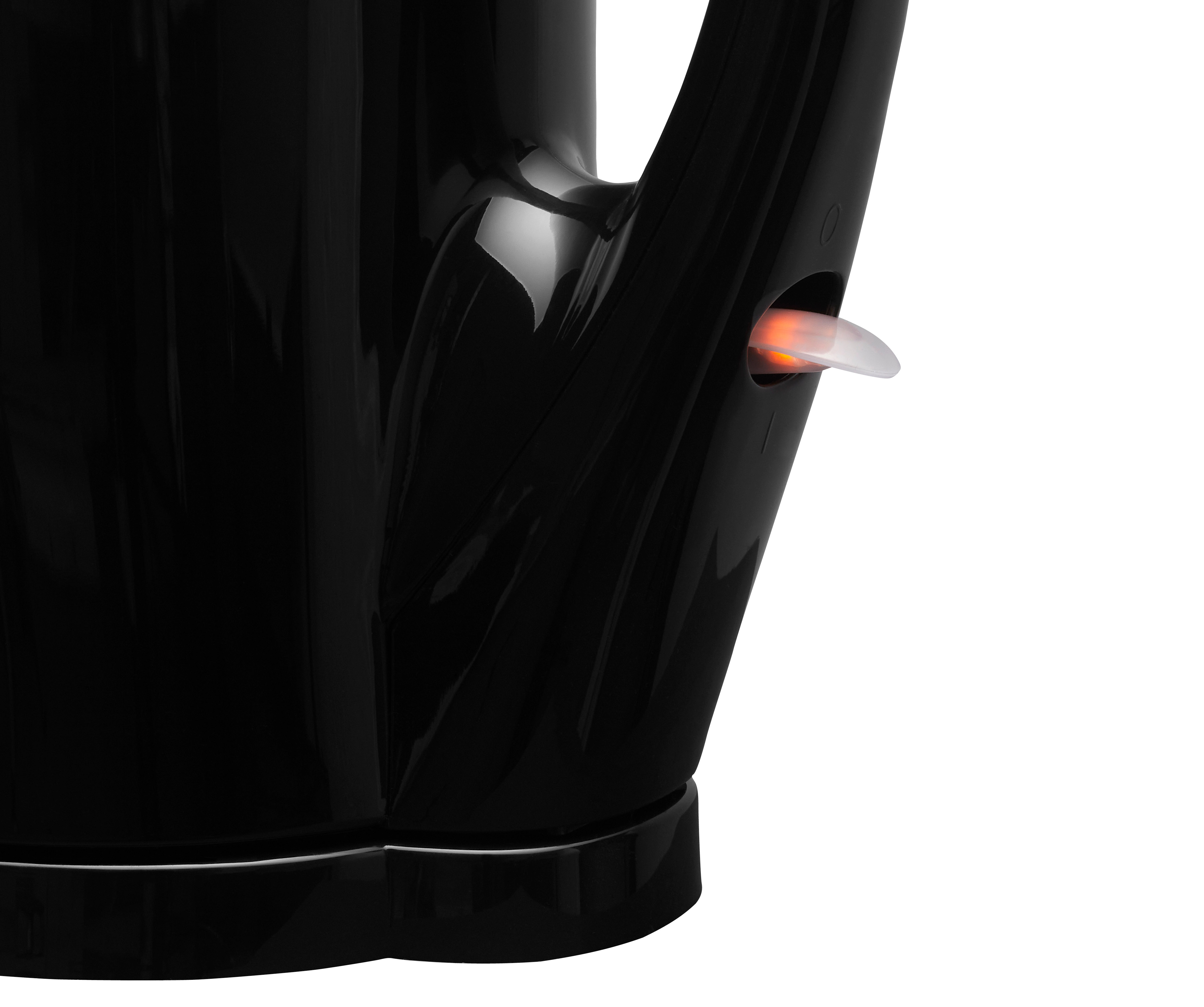Nahaufnahme eines schwarzen Kesselgriffs mit orangefarbenem Licht.