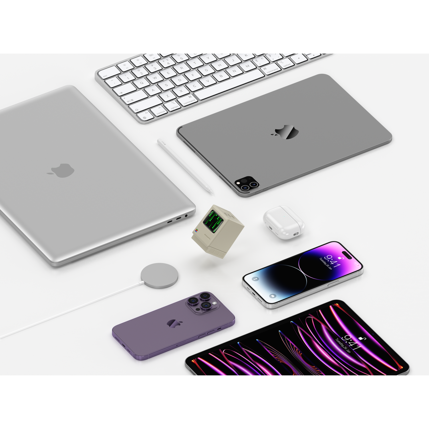 Una collezione di prodotti Apple: laptop, tablet, tastiera, telefono, matita, auricolari e base di ricarica.
