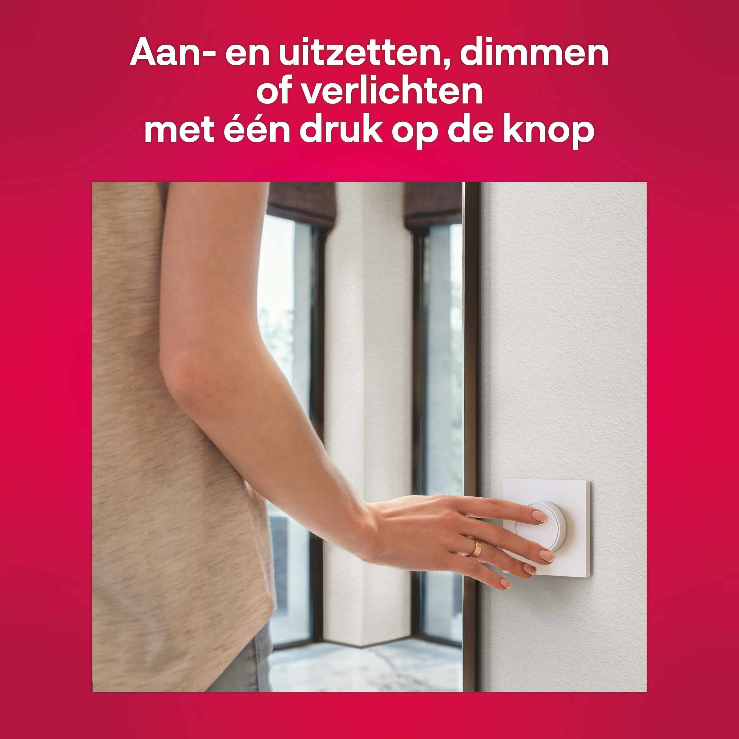 Woman's hand turns a white light switch on a wall. Windows are visible in the background.