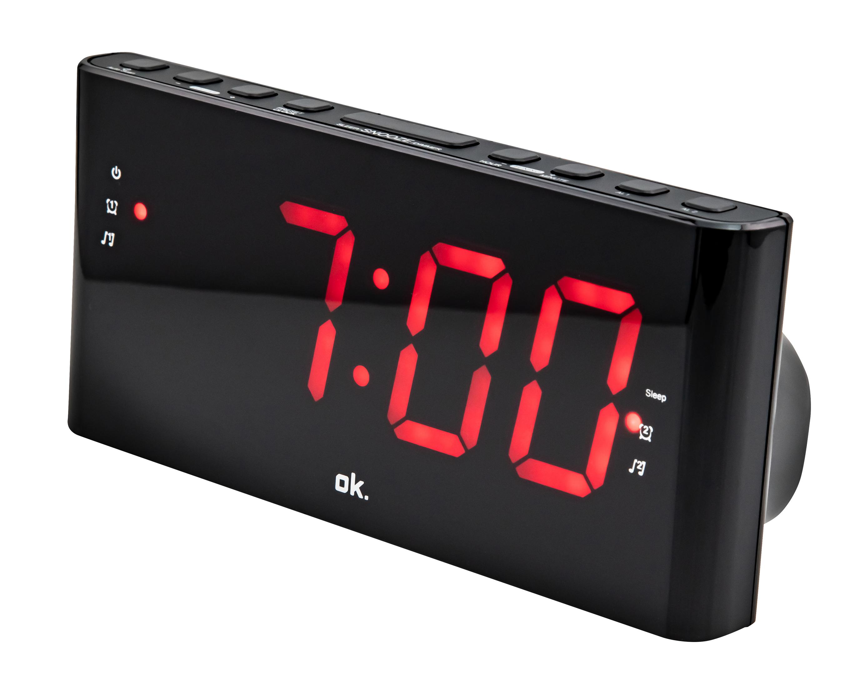 Schwarzer digitaler Wecker mit roter Anzeige 7:00. Die Uhr hat Knöpfe.