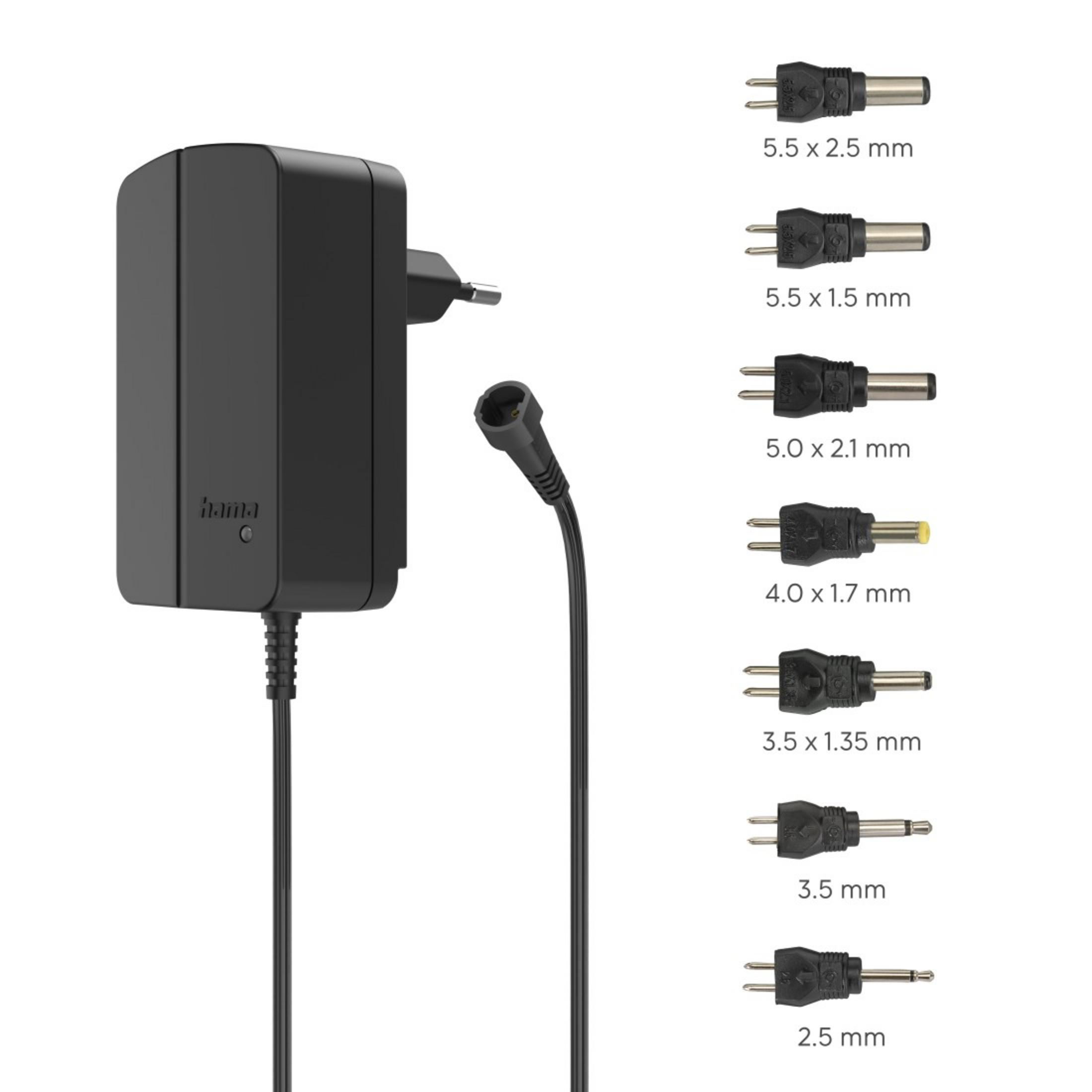 Ein schwarzer Netzadapter mit verschiedenen Steckeraufsätzen. Mehrere Adapterköpfe sind sichtbar.