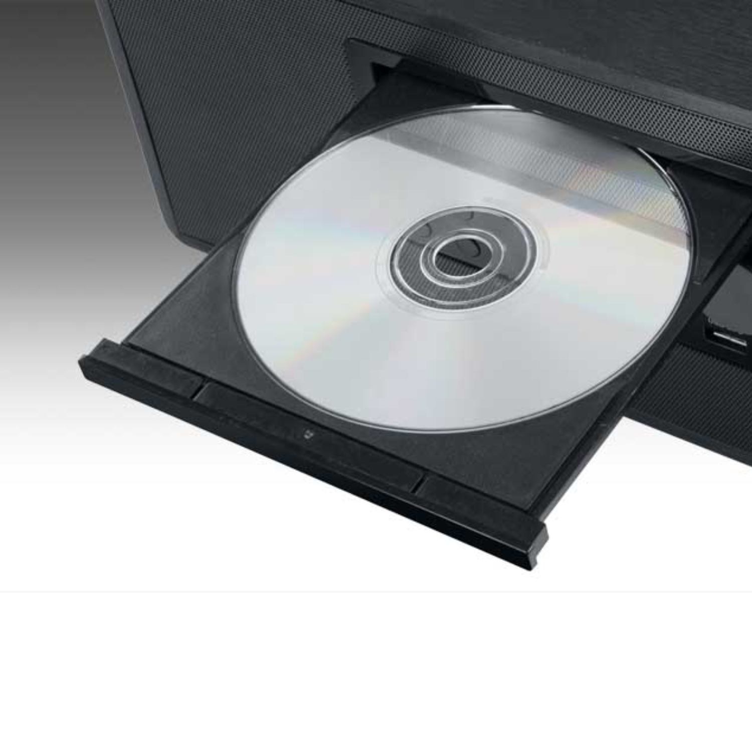 CD in a computer drive. The CD is silver. White background.