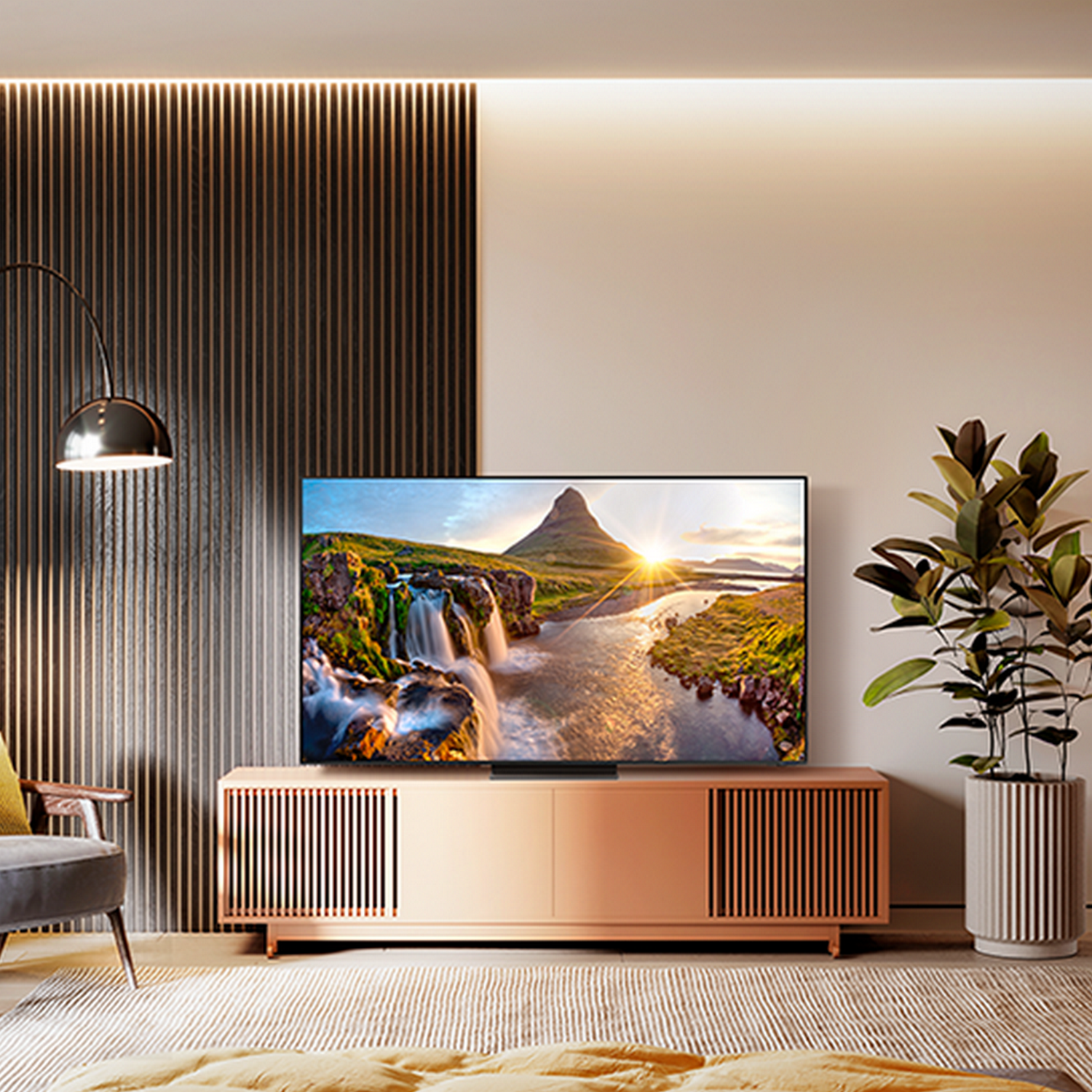 Salon z telewizorem na różowej szafce, rośliną i sceną wodospadu.