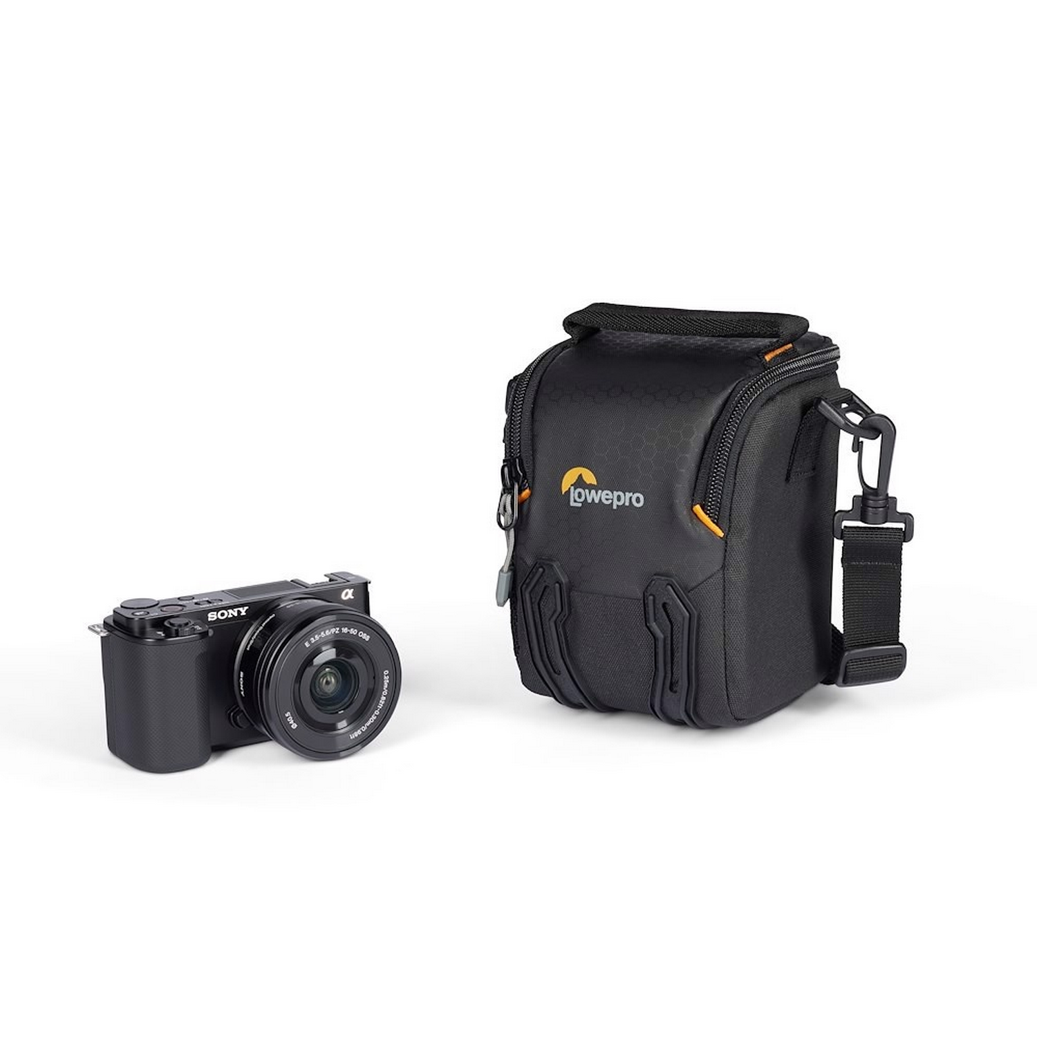 Black camera and Lowepro bag. The bag is next to the camera.